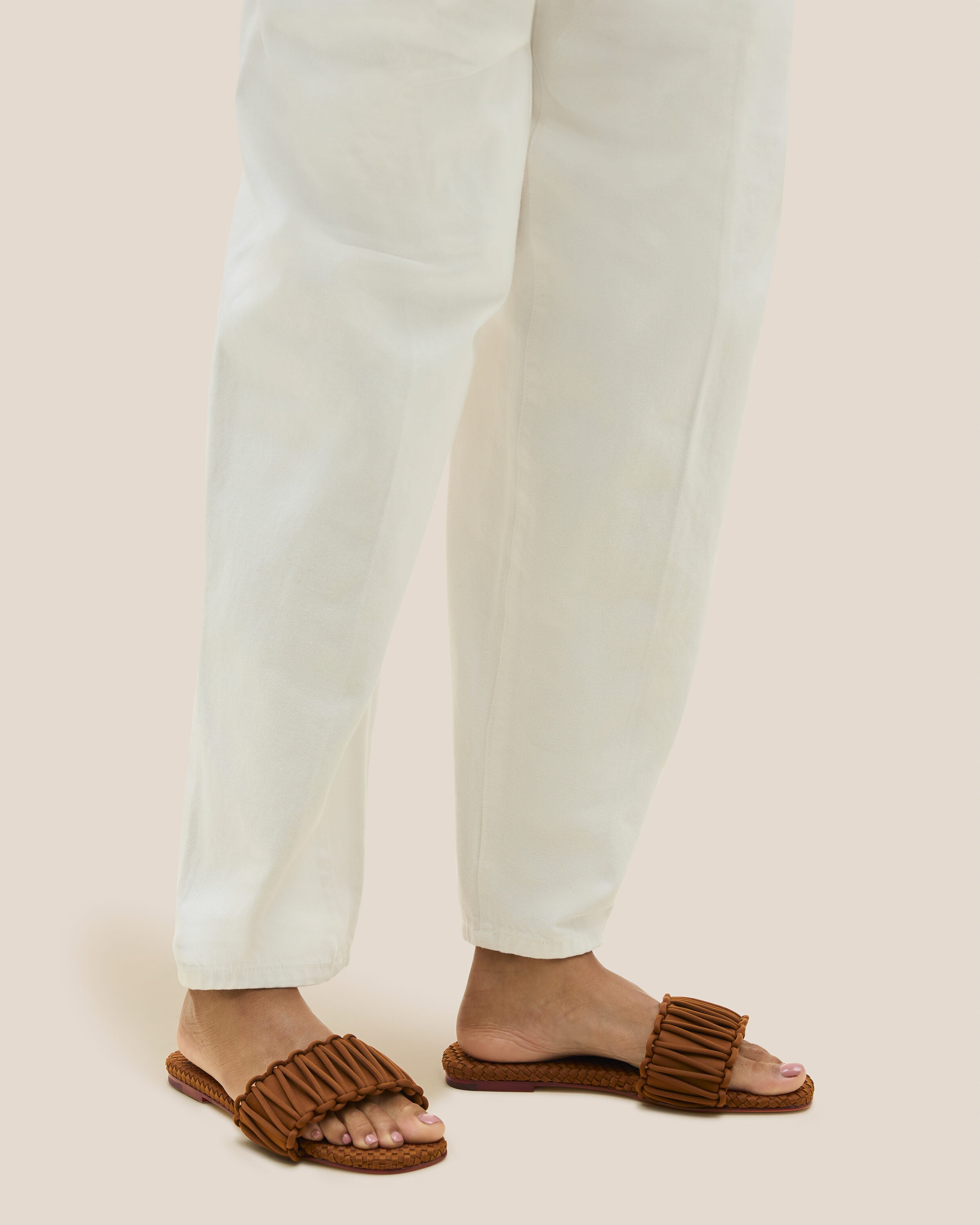 The Athens Slide in Teak shown on model.