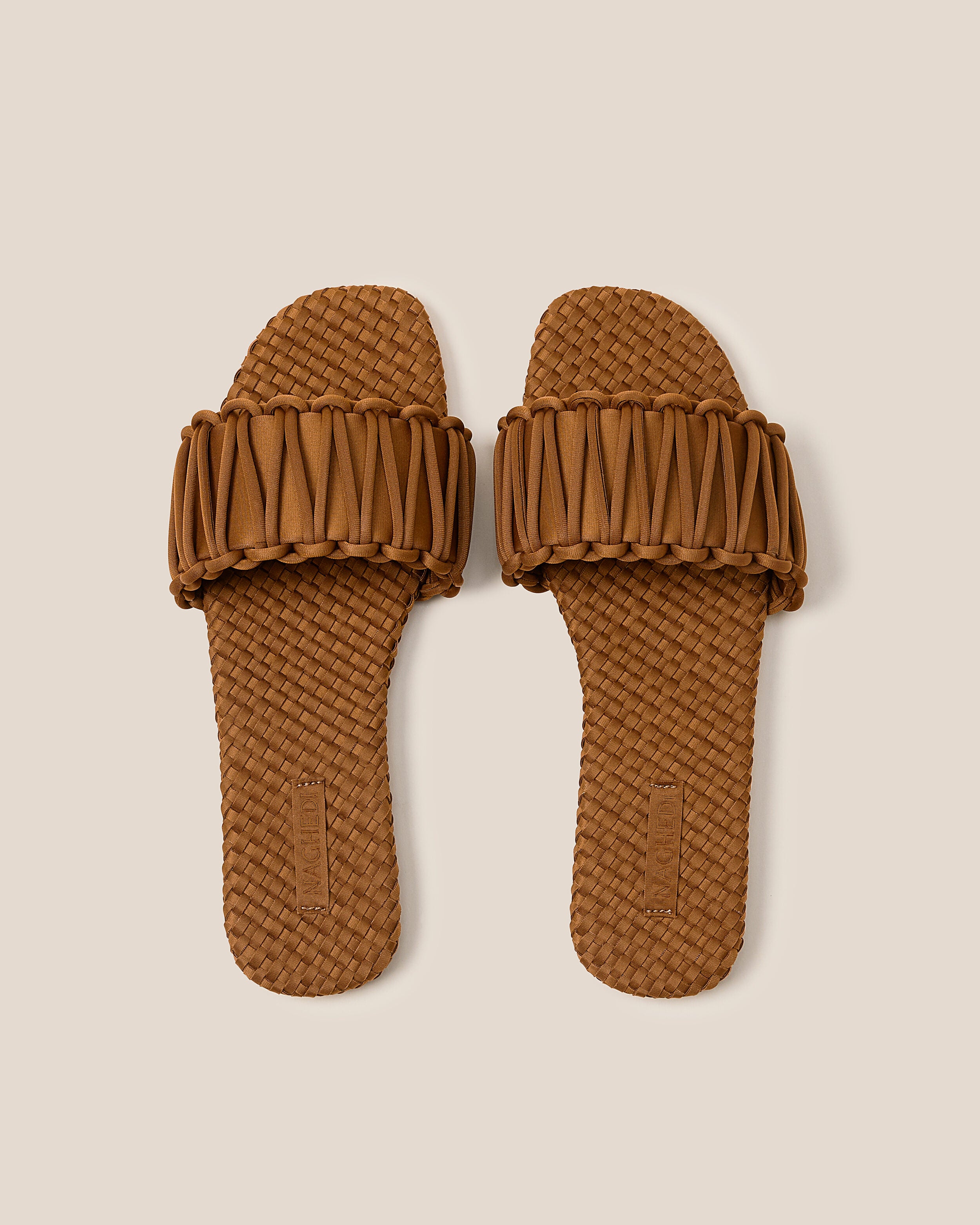 Top view of pair of The Athens Slide in Teak showing the handwoven neoprene insole.