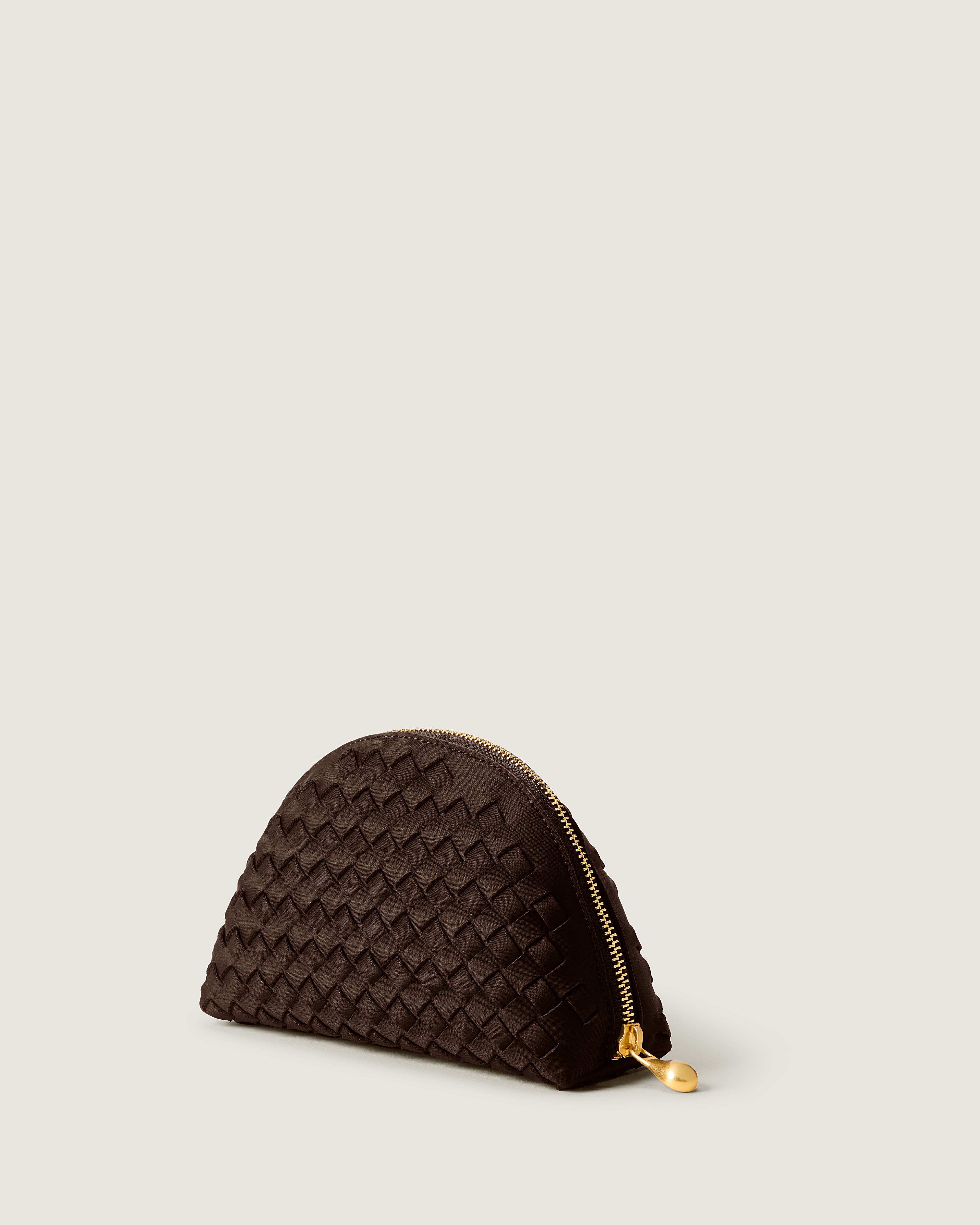Atlas Cosmetic Case in Chocolate shown from a side angle, highlighting its handwoven neoprene construction and wrap-around zip closure.