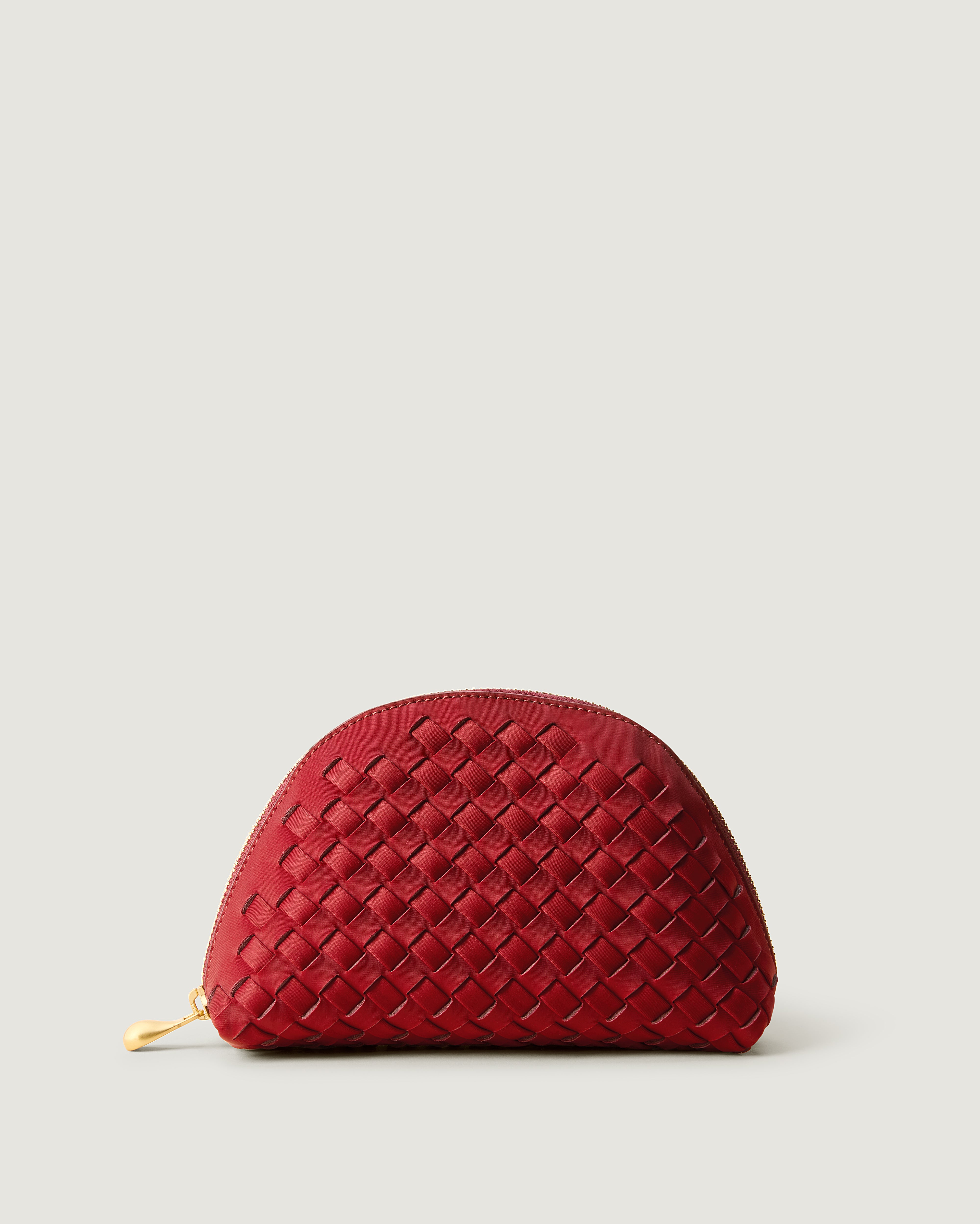 Atlas Cosmetic Case in Rosso, a rich red tone, in handwoven neoprene, featuring a wrap-around zip closure.