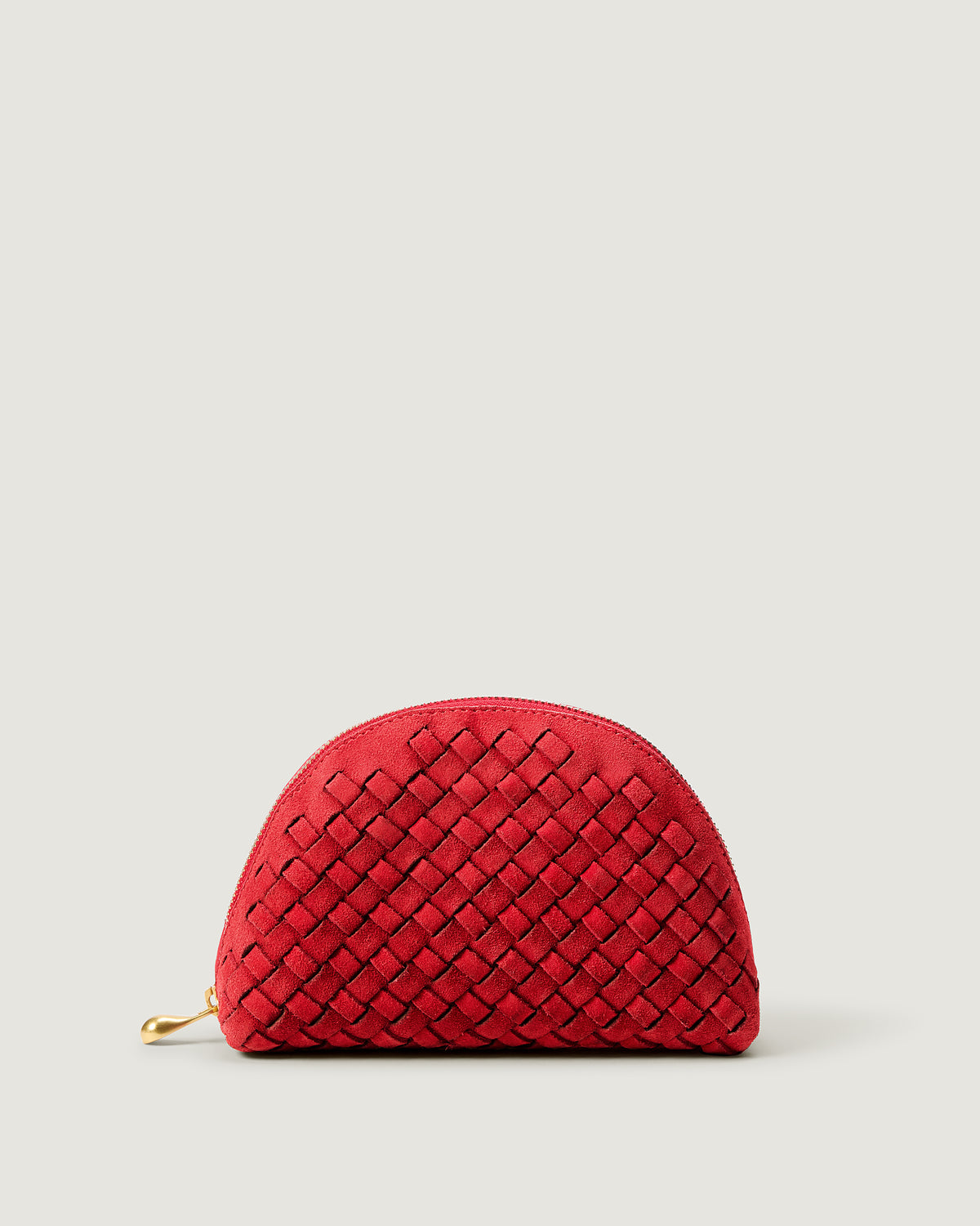 Atlas Cosmetic Case in Cerise, a bright cherry red tone, in handwoven suede, featuring a wrap-around zip closure.