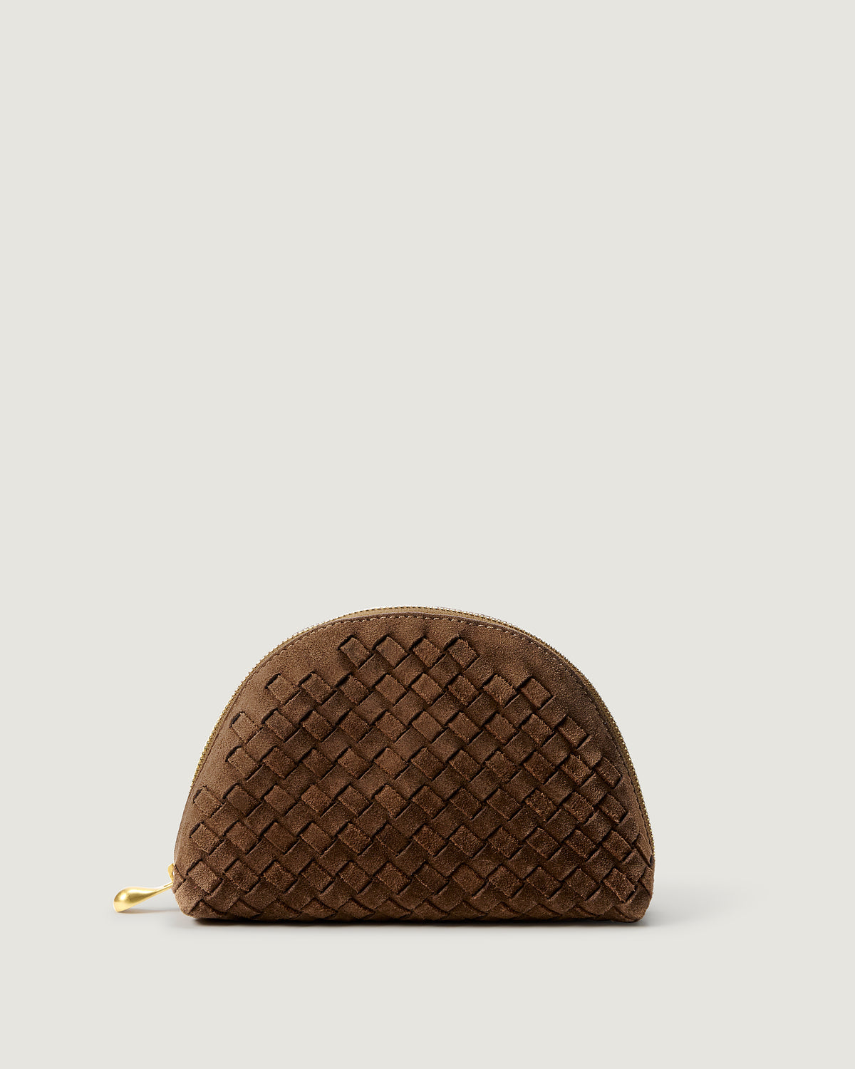 Atlas Cosmetic Case in Teak, a saddle brown tone, in handwoven suede, featuring a wrap-around zip closure.