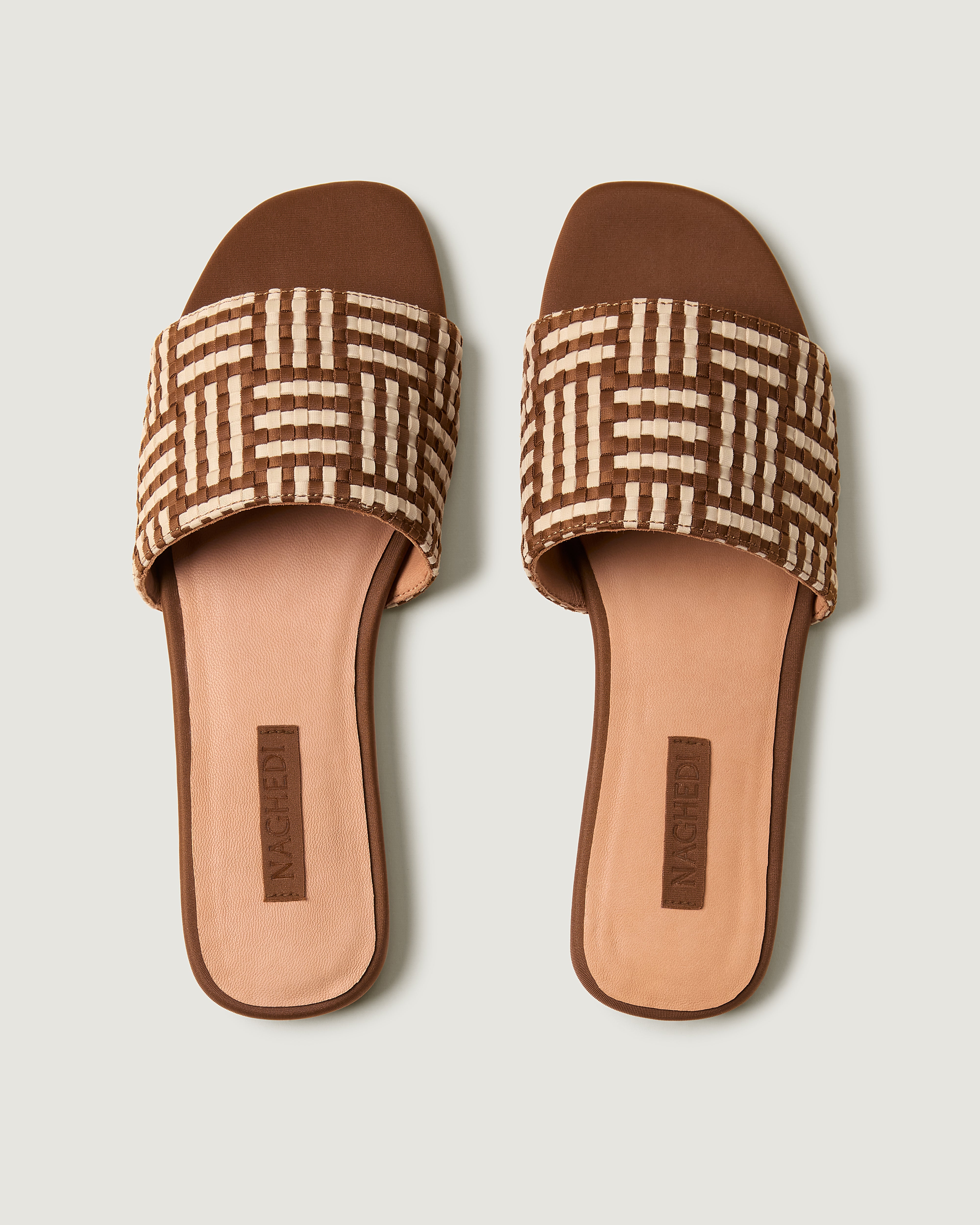 Top view of pair of The Cairo Slide in Almond showing the padded neoprene insole.