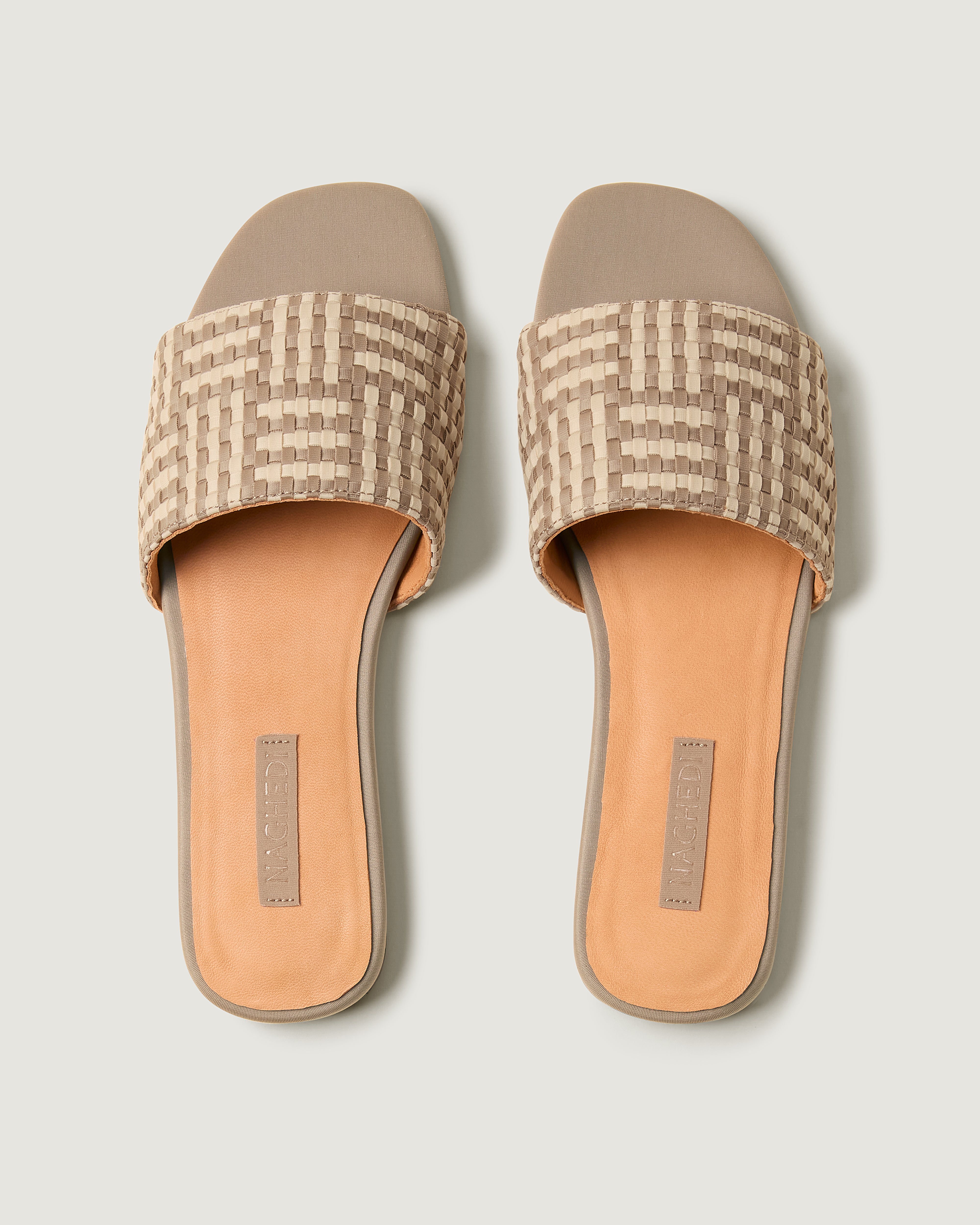 Top view of pair of The Cairo Slide in Chalk showing the padded neoprene insole.