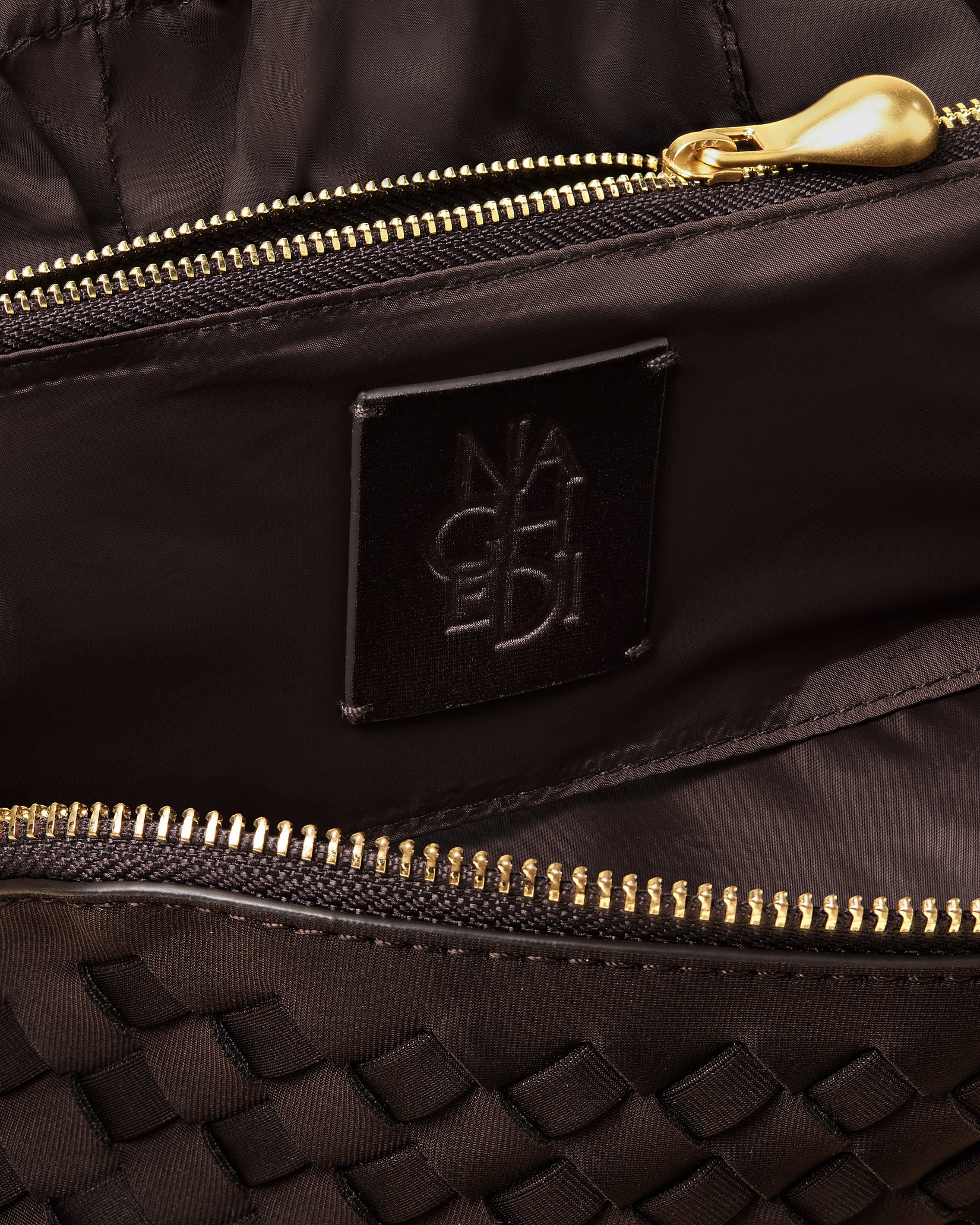 Close-up of handwoven detailing on Caravan Medium Cosmetic Case in Chocolate.