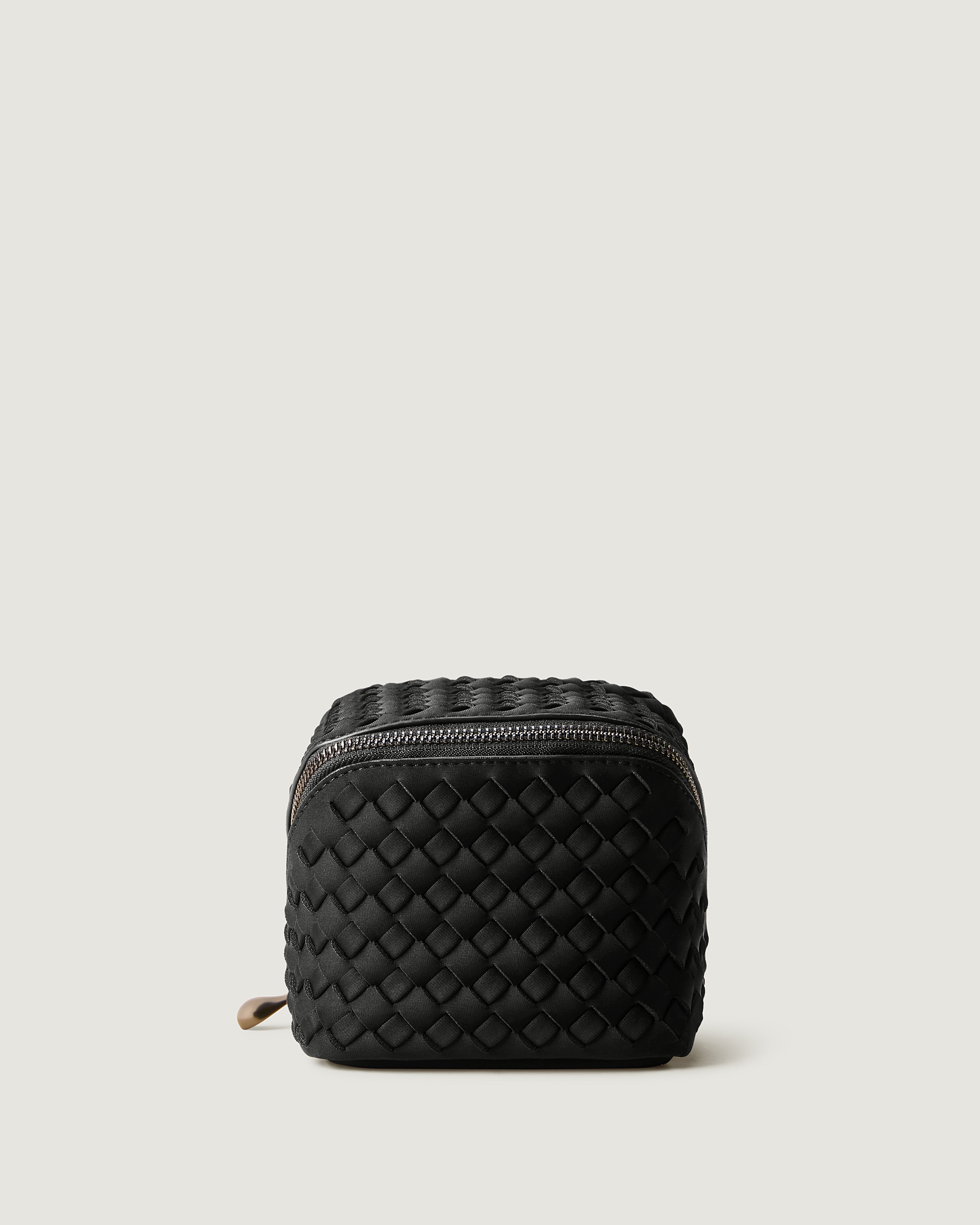 Caravan Cosmetic Case in Onyx featuring a wrap-around zip closure.
