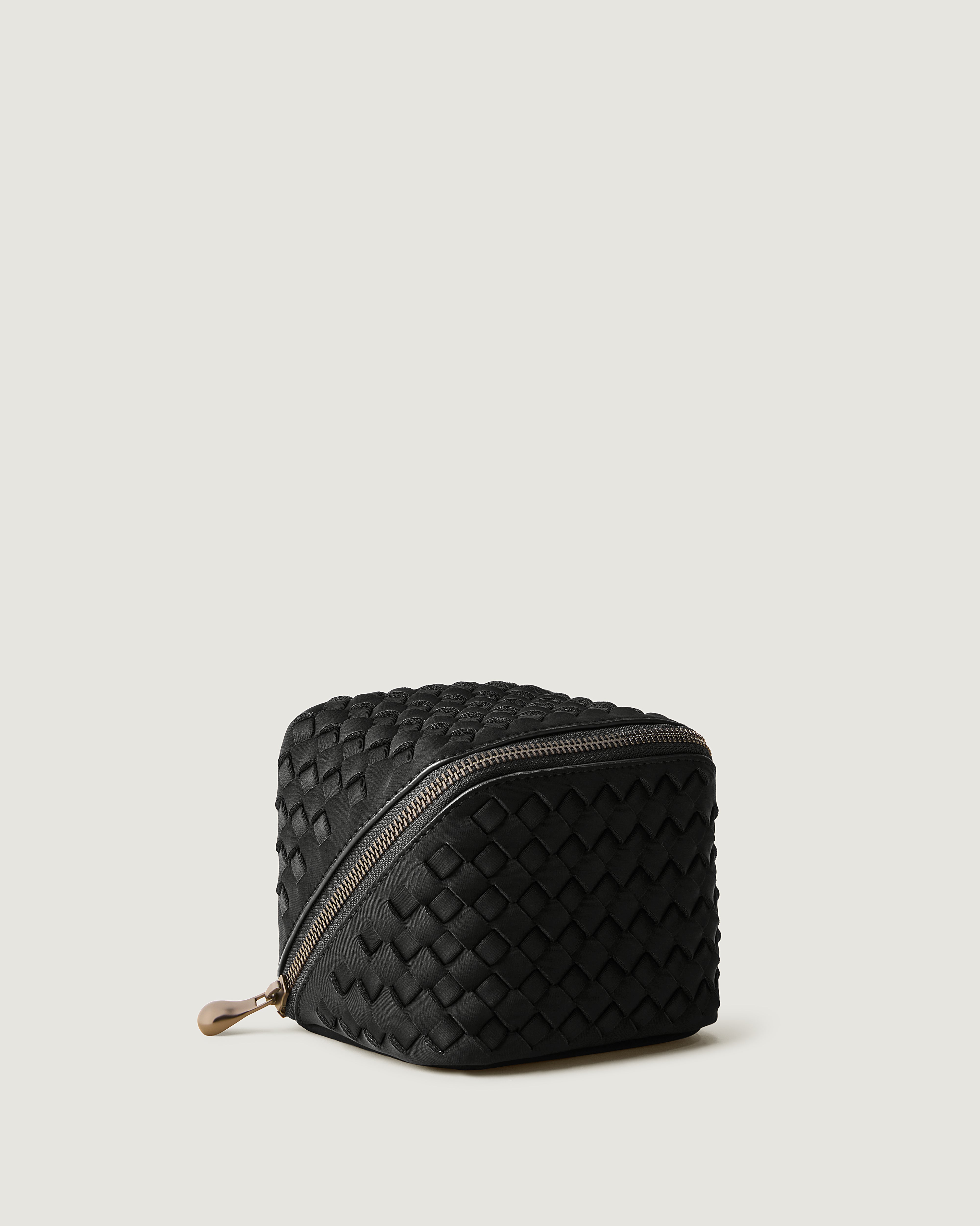 Caravan Cosmetic Case in Onyx shown from a side angle, highlighting its  and wrap-around zip closure.