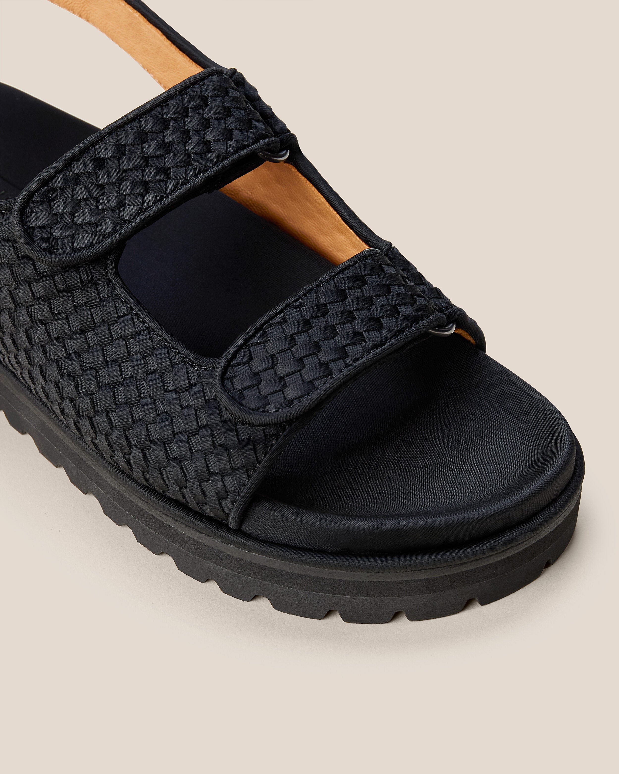 Close-up of The Catalina Sandal in Onyx showing its open toe and square silhouette.