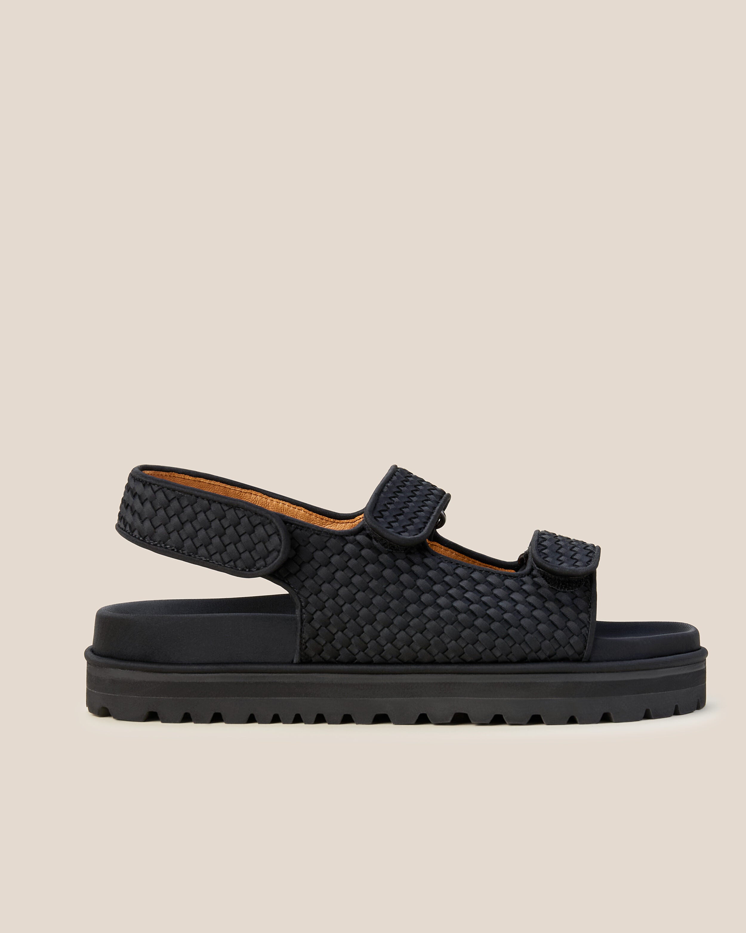 Side view of The Catalina Sandal in Onyx, a true black tone, featuring an open toe and square silhouette, featuring a 3-strap sandal.