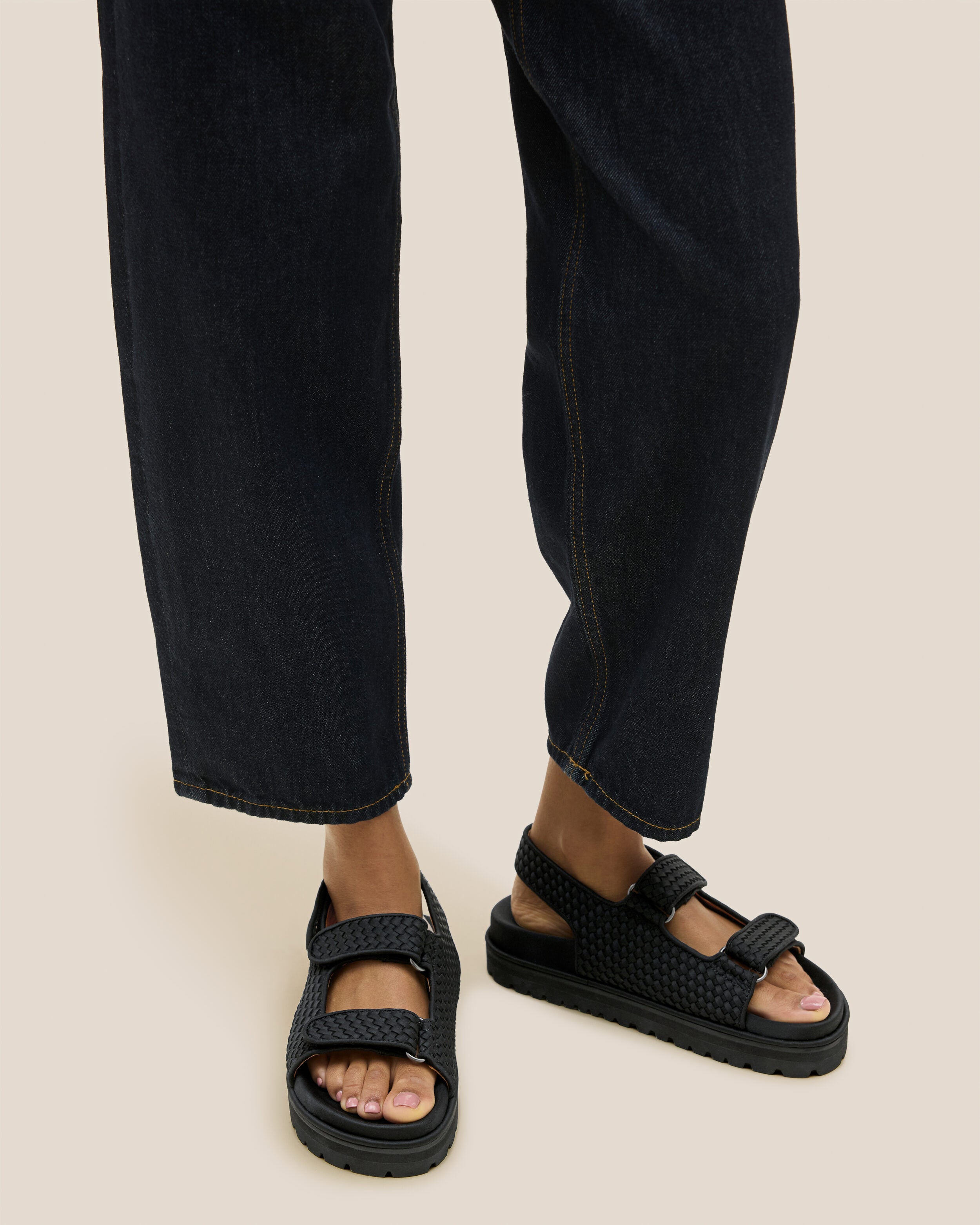 The Catalina Sandal in Onyx shown on model.