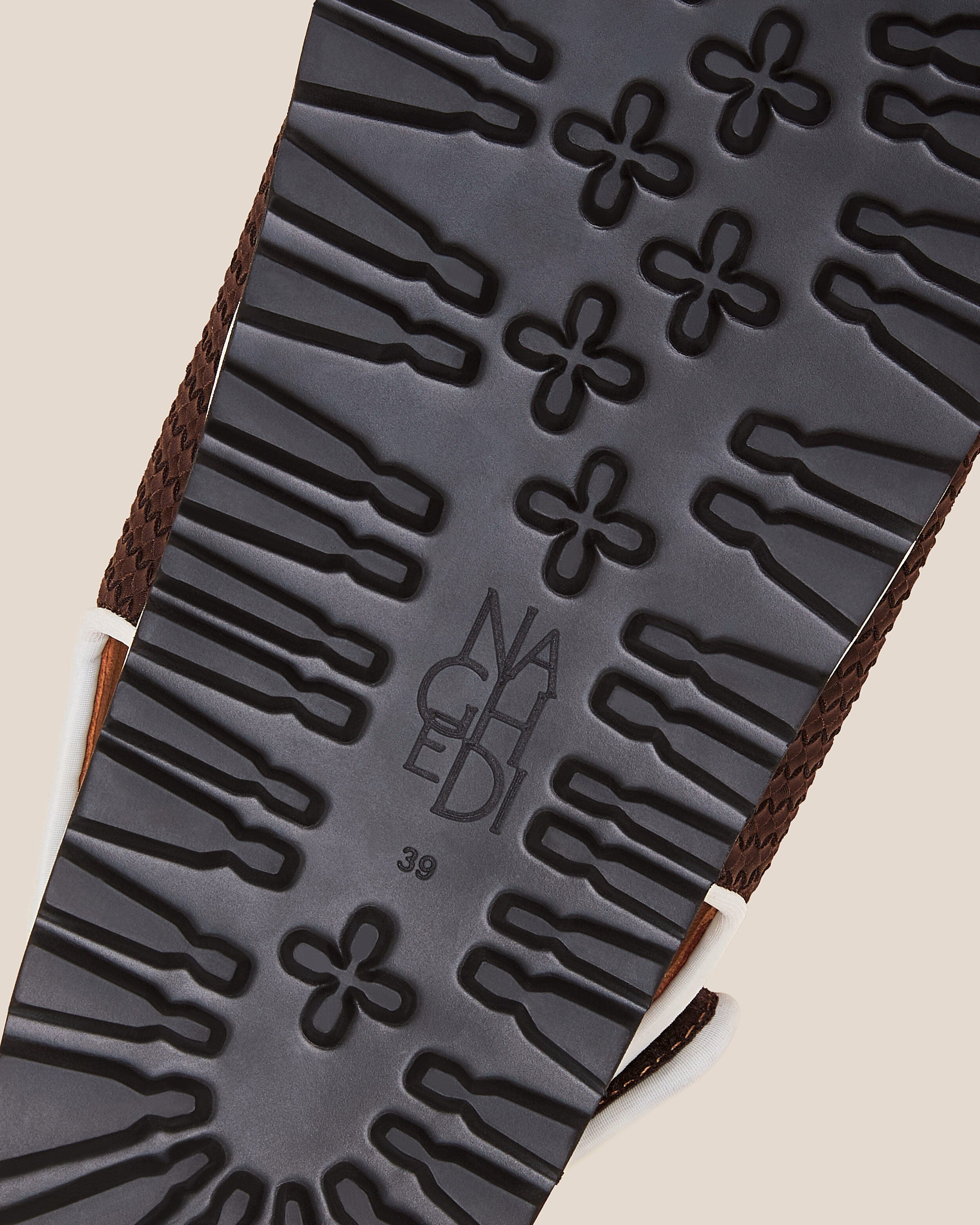 Shoe sole showing extra lightweight eva sole, stamped NAGHEDI logo and size detail for The Catalina Sandal in Rhodes.