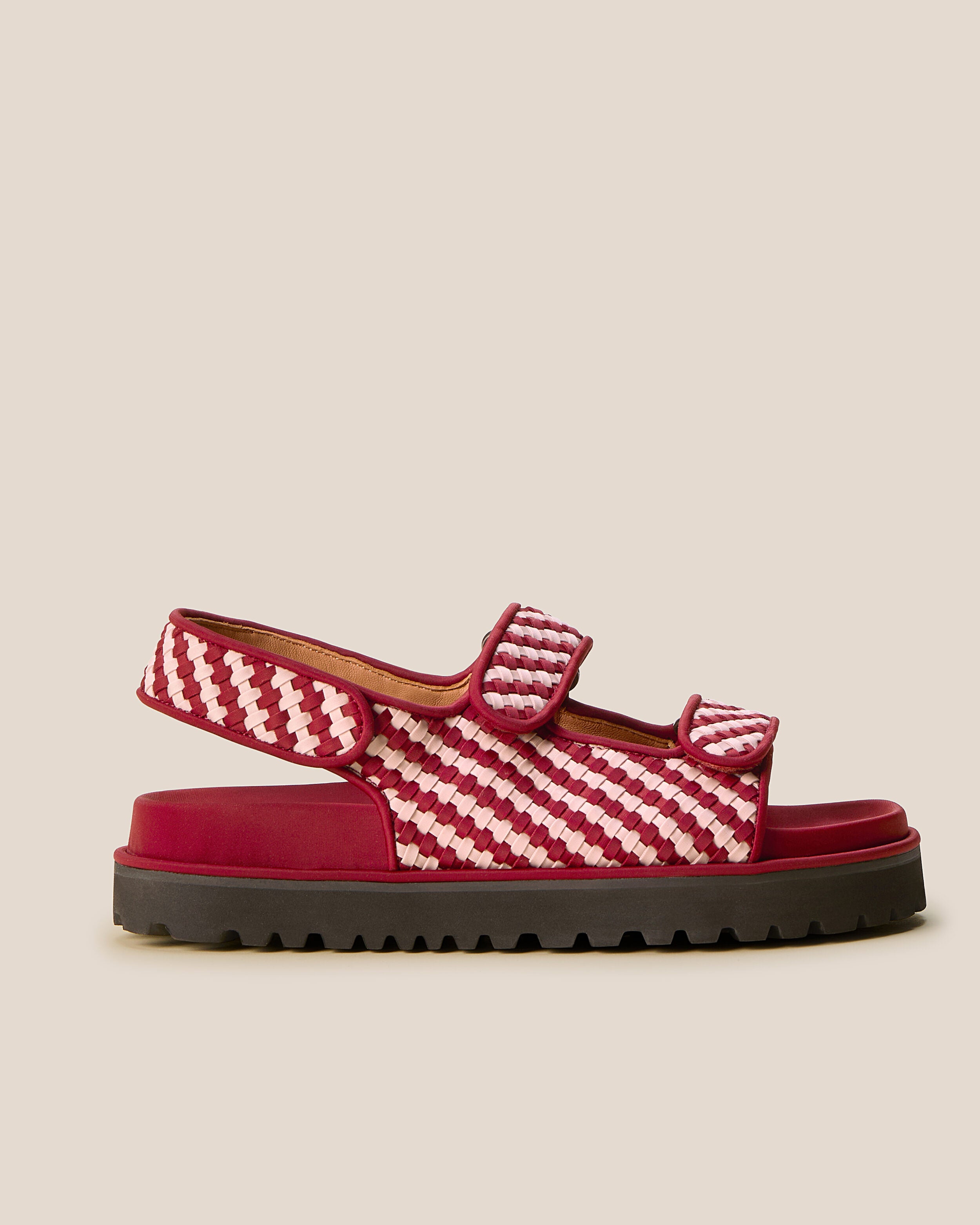 Side view of The Catalina Sandal in Lychee, a rich red and soft ballet pink tone, featuring an open toe and square silhouette, featuring a 3-strap sandal.