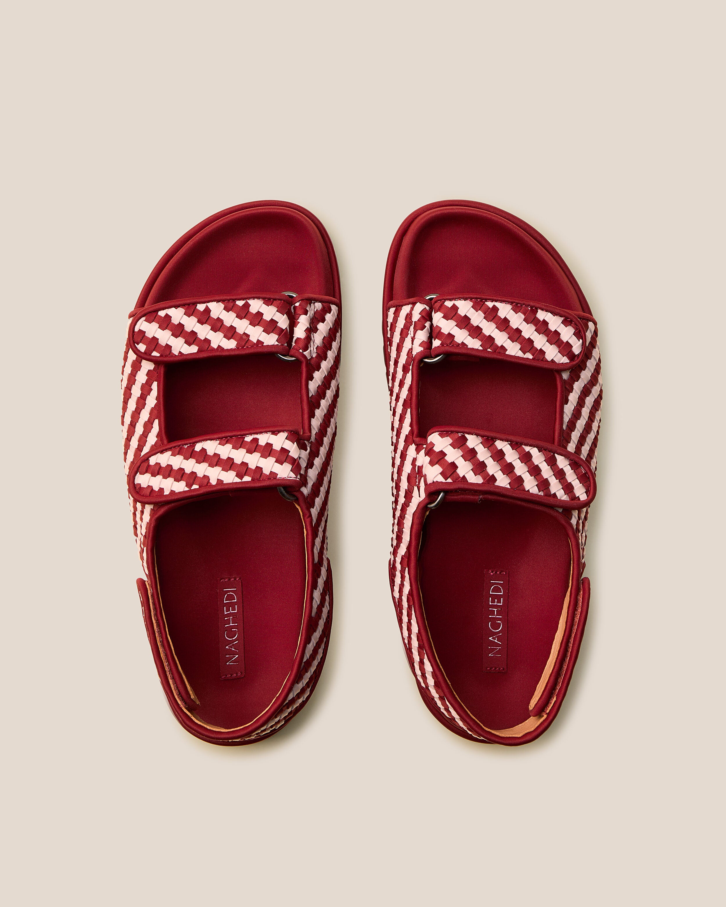 Top view of pair of The Catalina Sandal in Lychee showing the molded neoprene footbed.