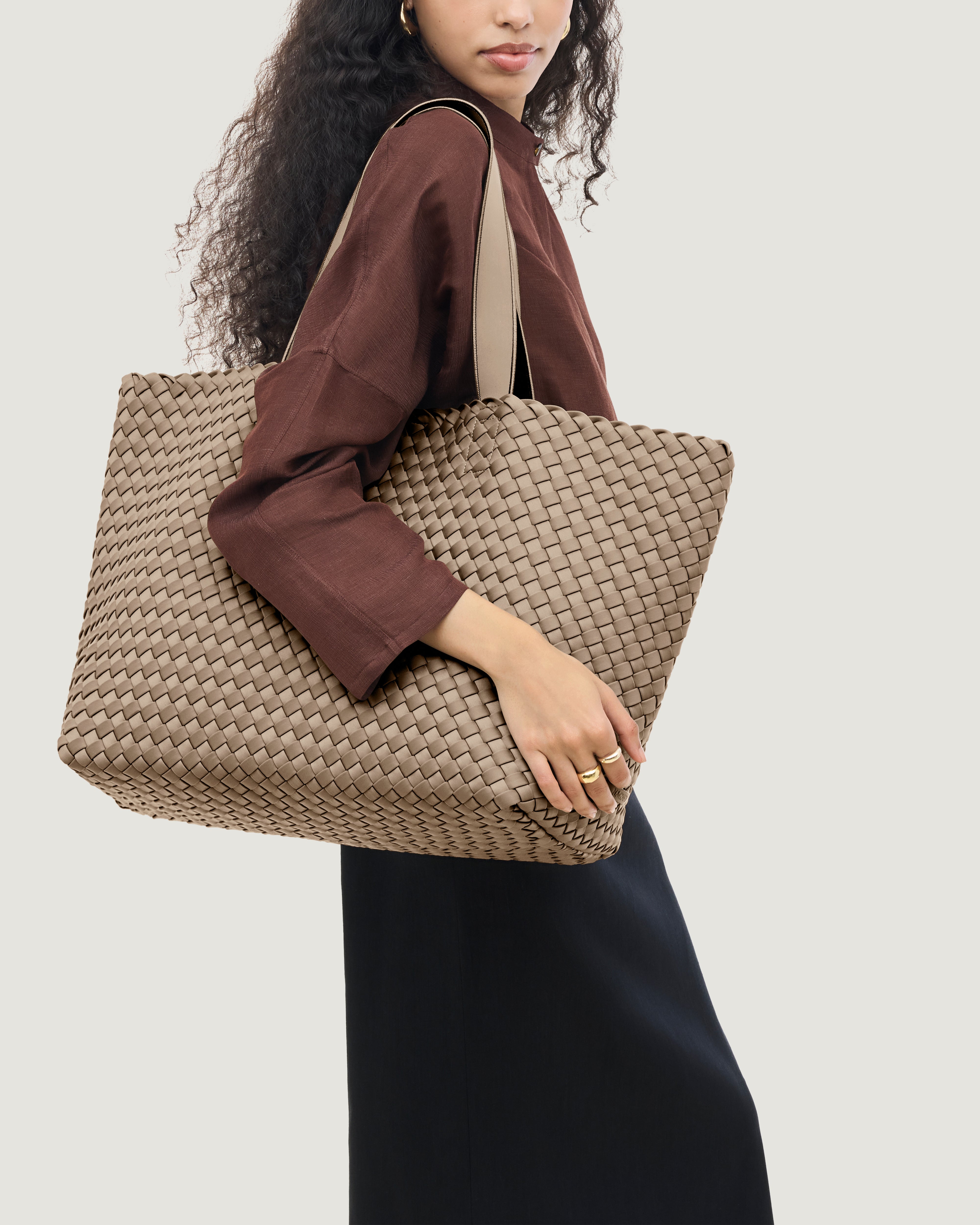Como Tote in Cashmere shown on model to illustrate scale and soft silhouette.