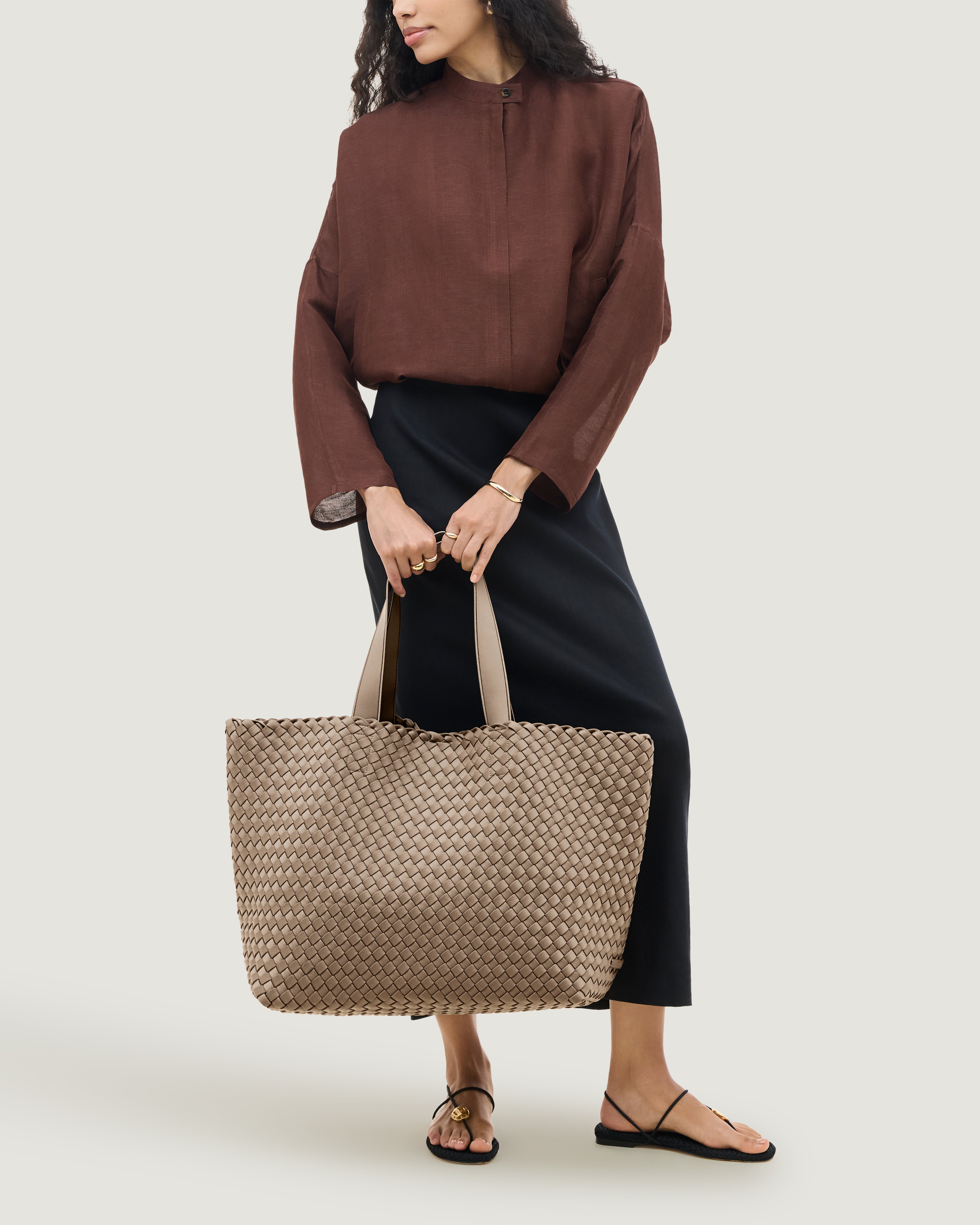 Como Tote in Cashmere shown on model to illustrate scale and soft silhouette.
