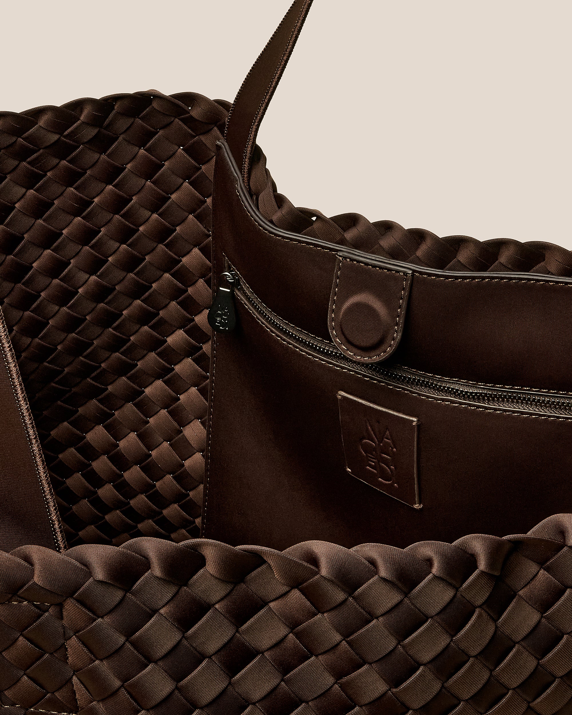 Interior close-up of Como Large Tote Bag in Chocolate showing its open top with magnetic snap closure, interior zip pocket, and unlined interior.