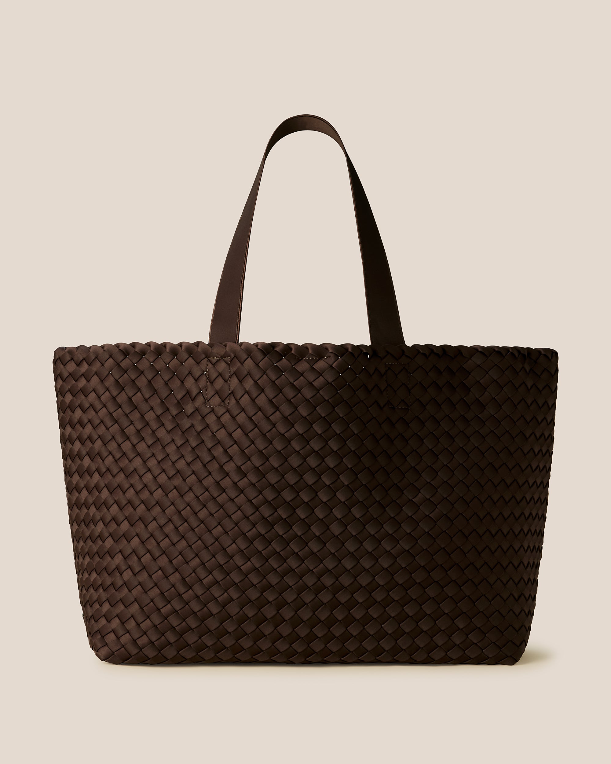 Como Large Tote Bag in Chocolate, a dark chocolate brown tone, in handwoven neoprene featuring an open top with magnetic snap closure, and neoprene shoulder straps.