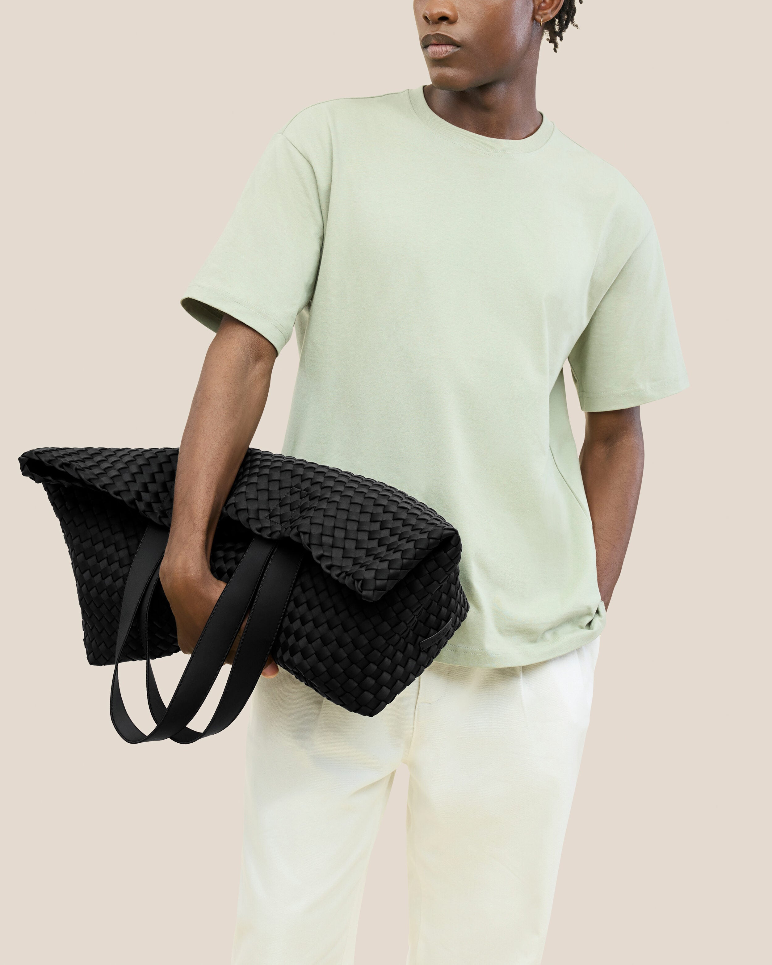 Como Tote in Onyx shown on model to illustrate scale and soft silhouette.