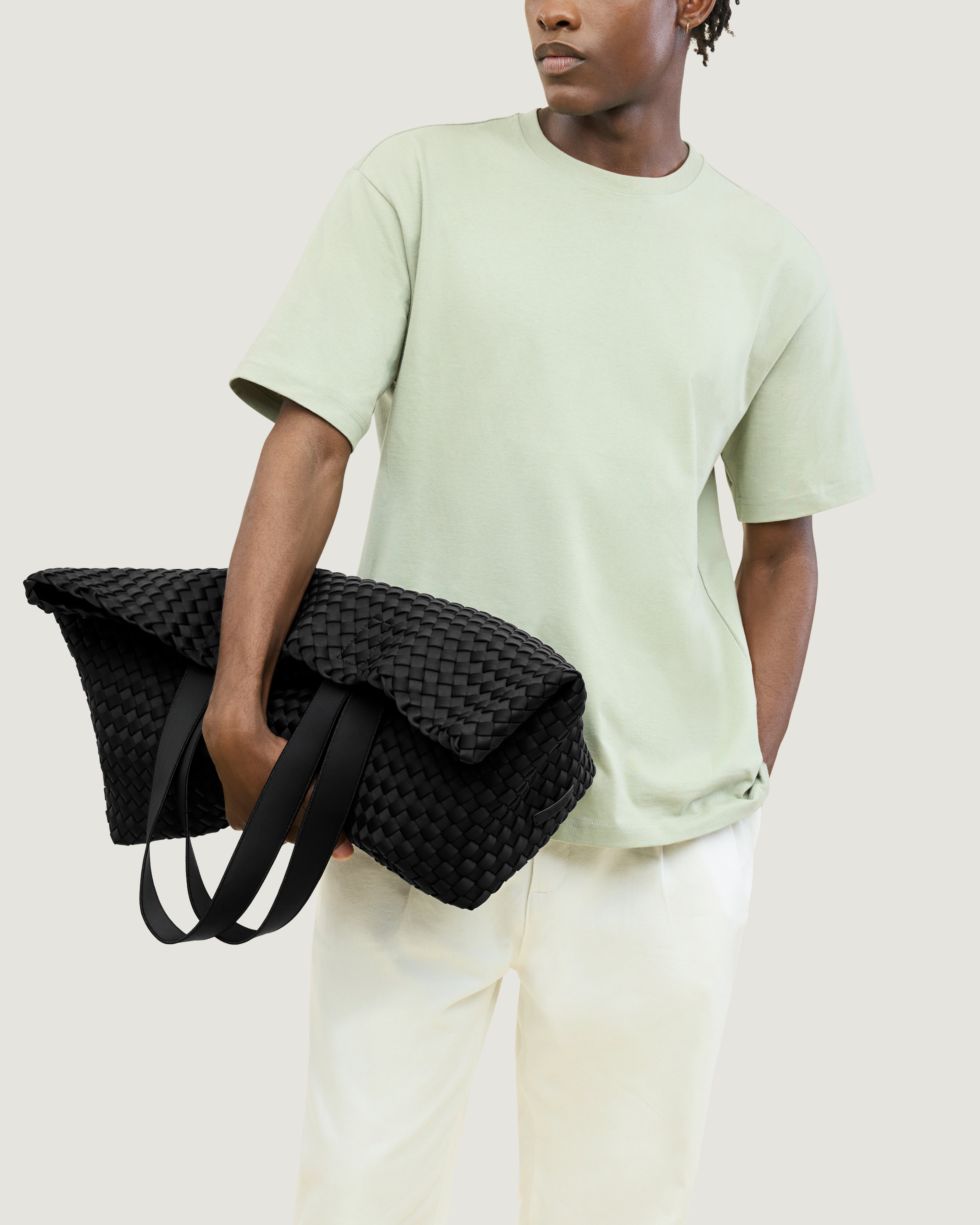 Como Tote in Onyx shown on model to illustrate scale and soft silhouette.