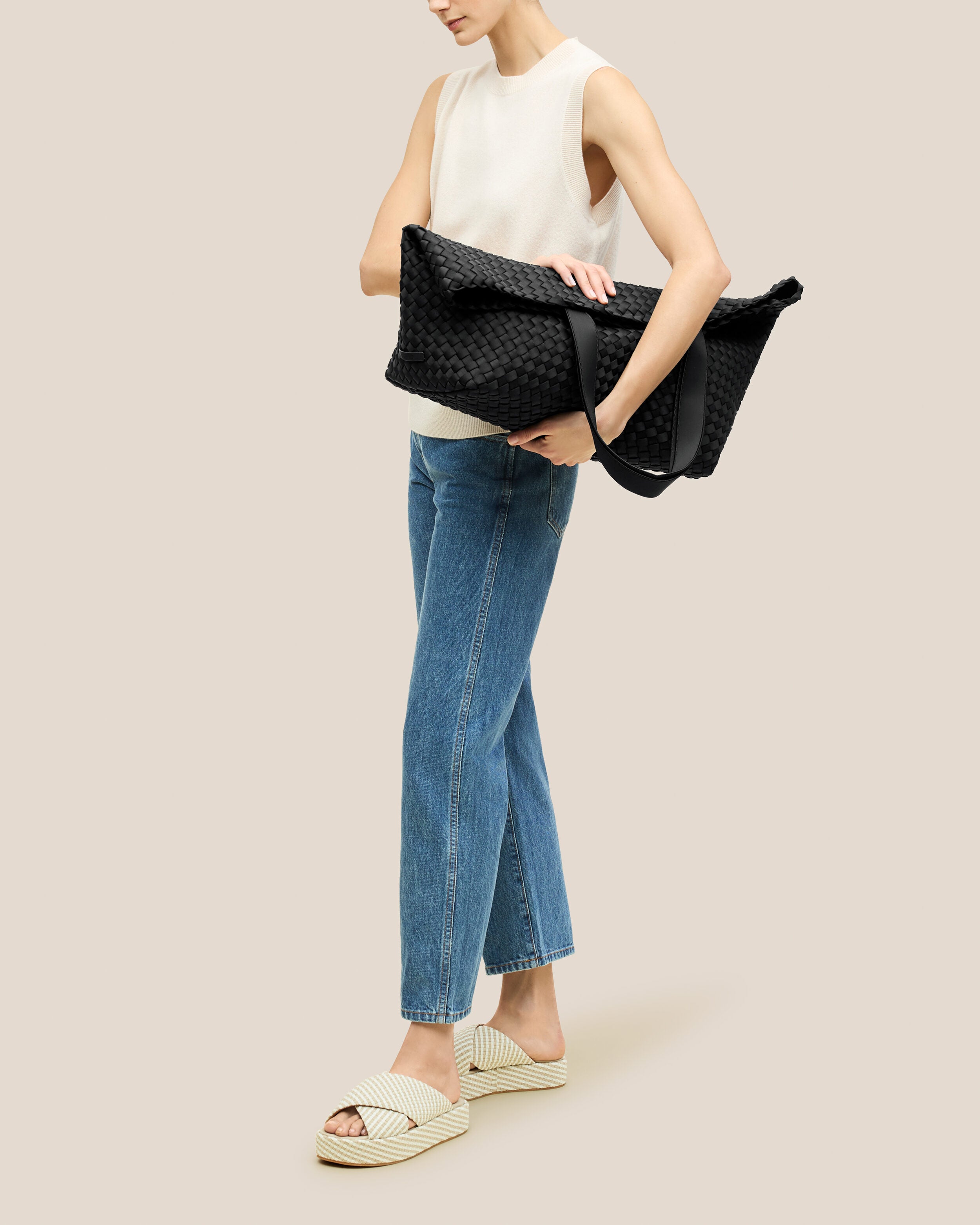 Como Tote in Onyx shown on model to illustrate scale and soft silhouette.