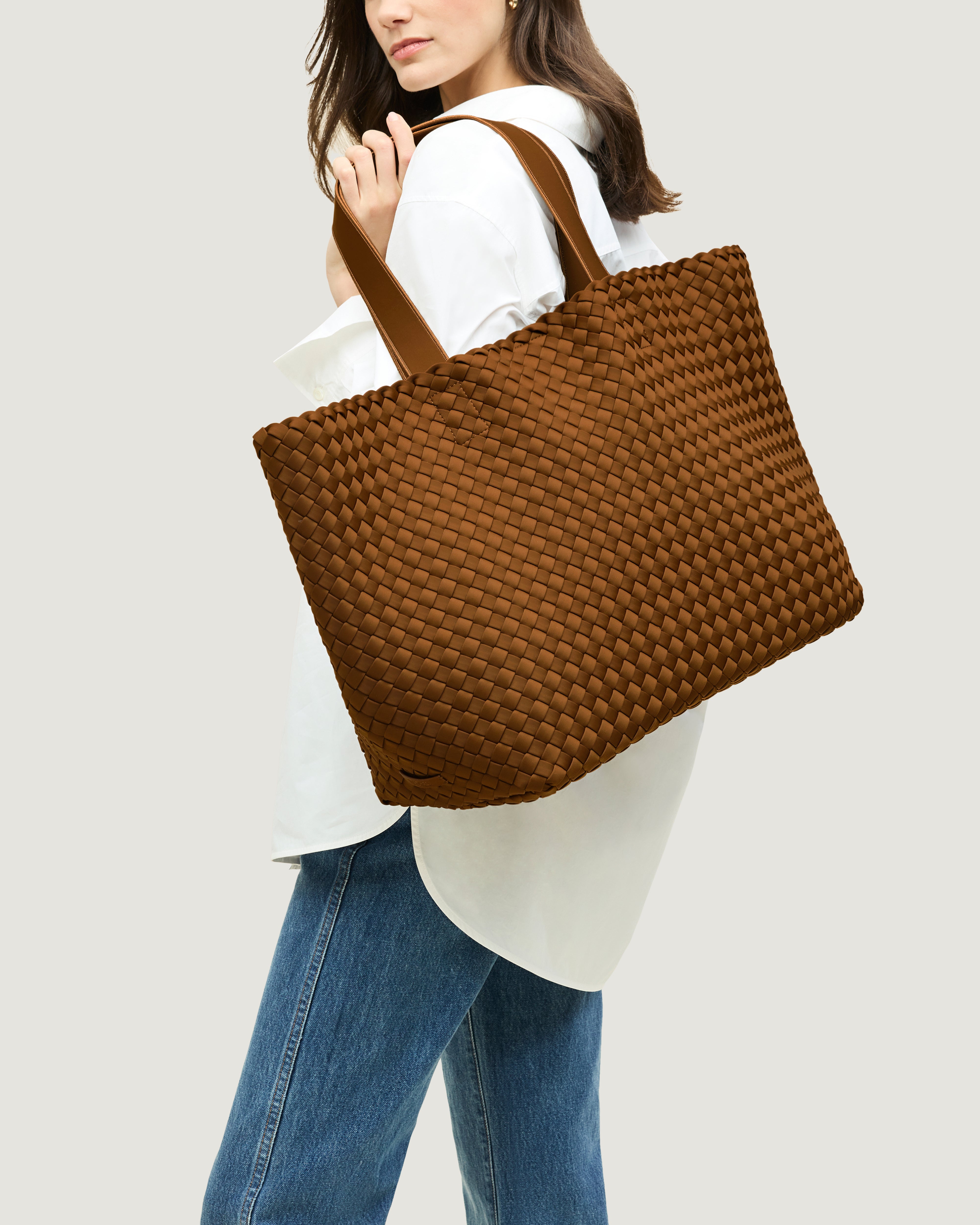 Como Tote in Teak shown on model to illustrate scale and soft silhouette.