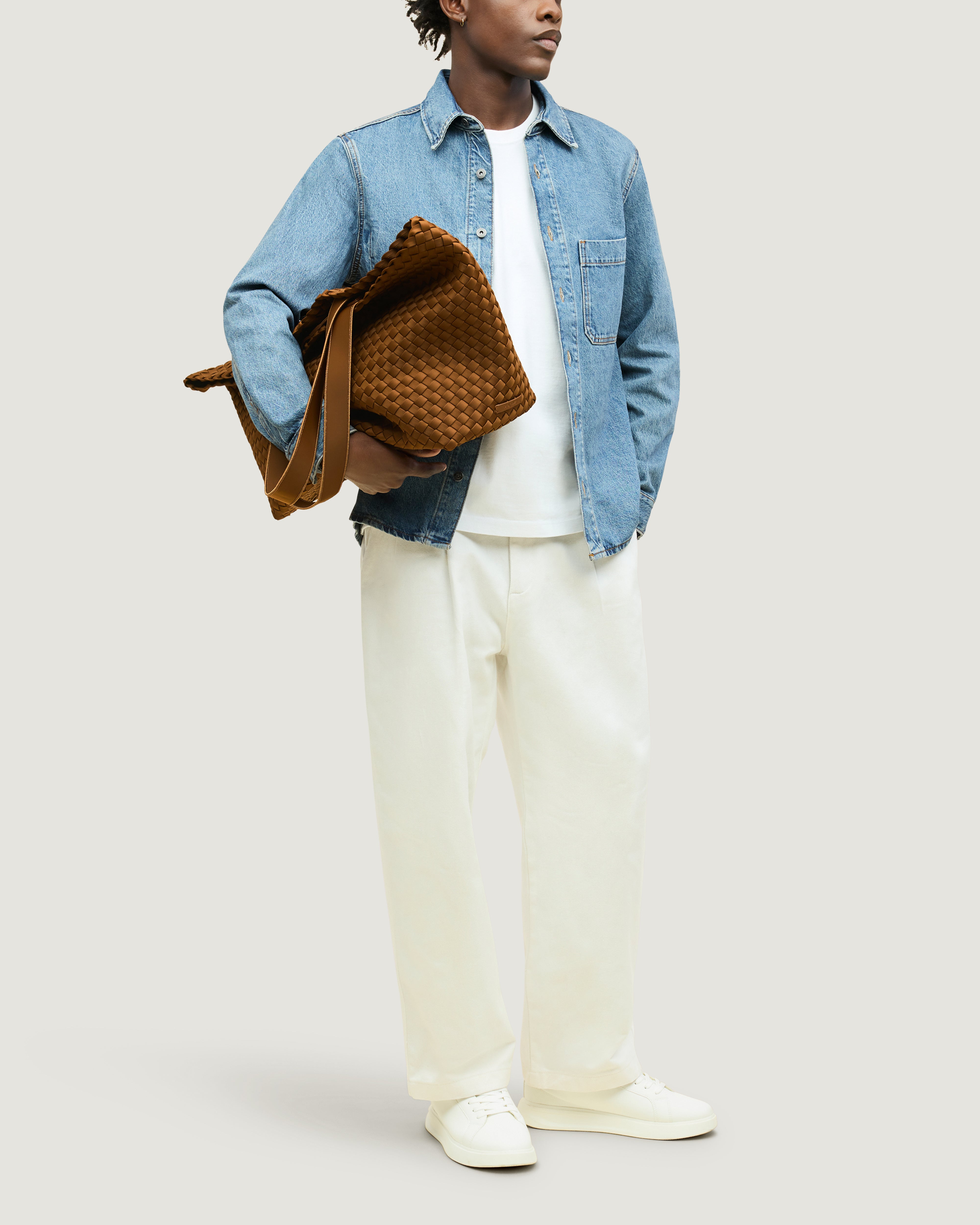 Como Tote in Teak shown on model to illustrate scale and soft silhouette.