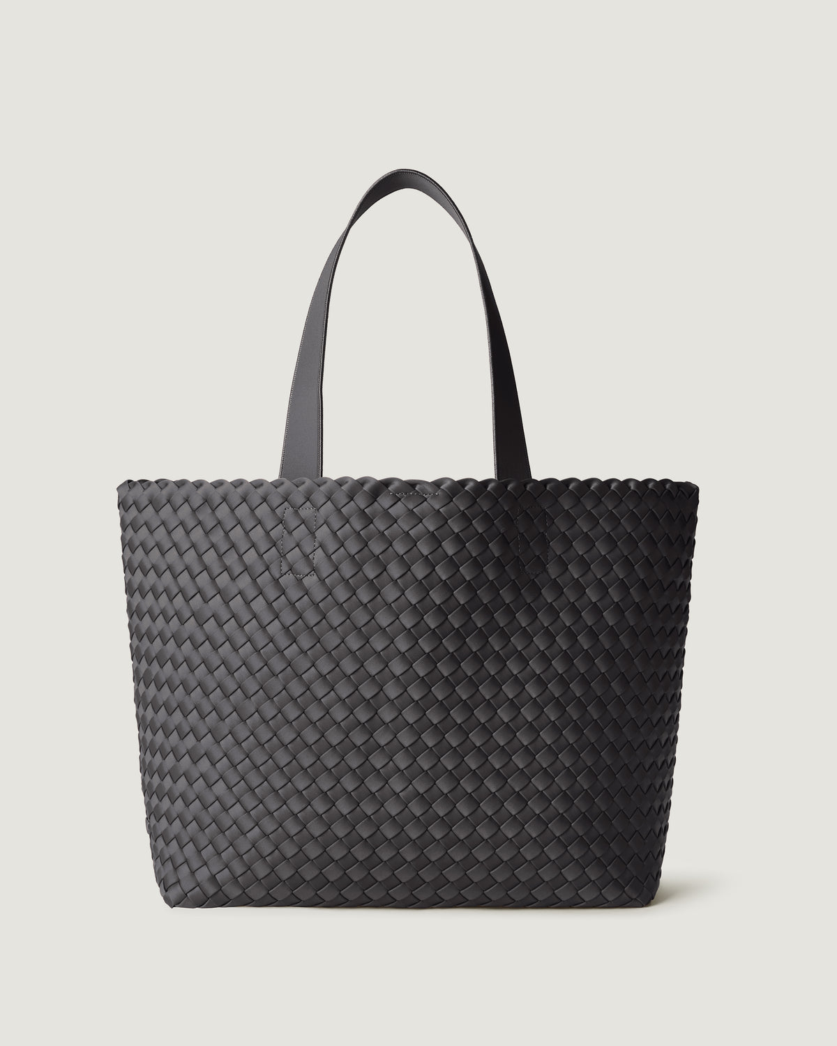 Como Tote in Ash, an ash gray, in handwoven neoprene, featuring an open top with magnetic snap closure, and neoprene shoulder straps