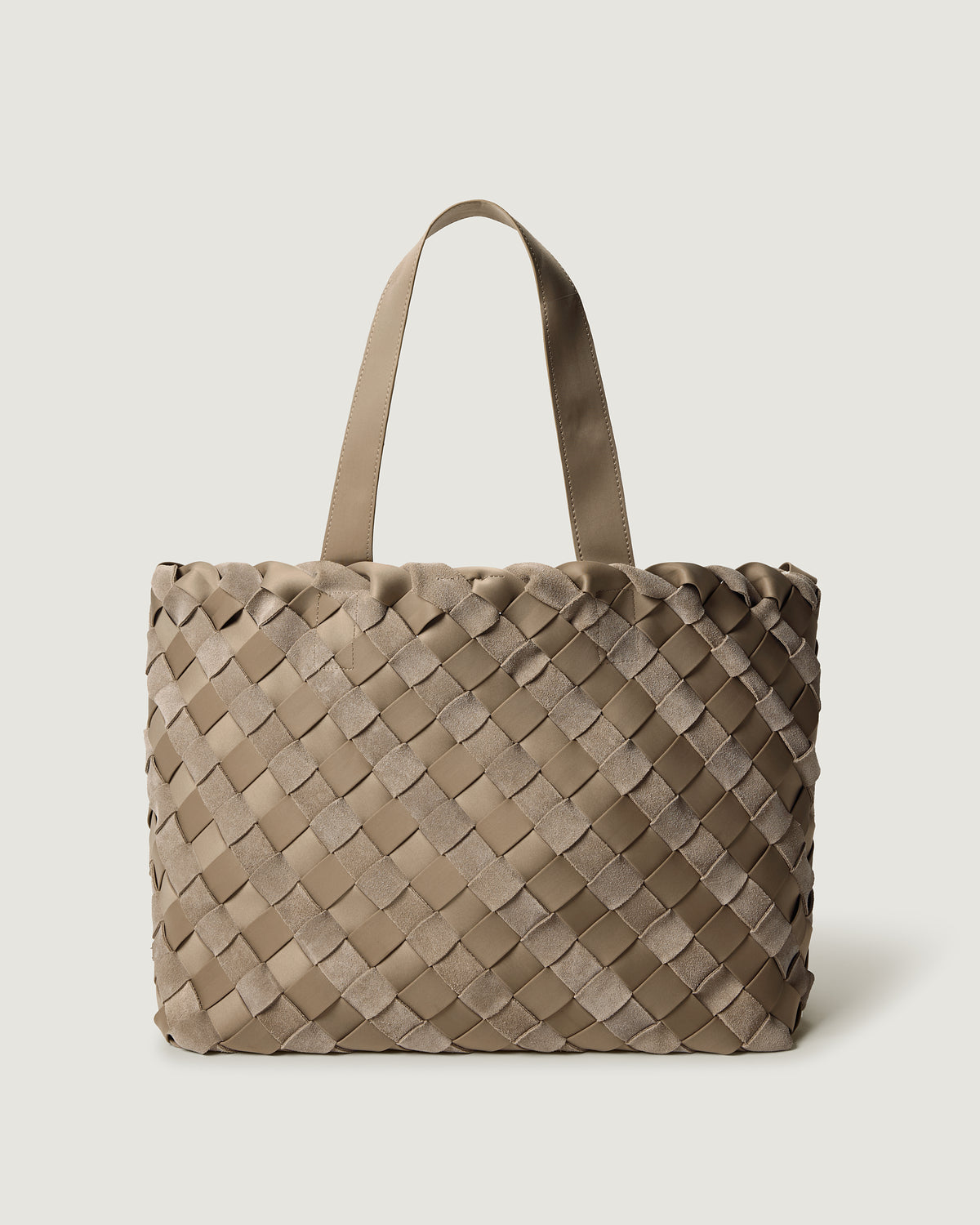 A large handwoven suede and neoprene tote bag in taupe brown with dual top handles.