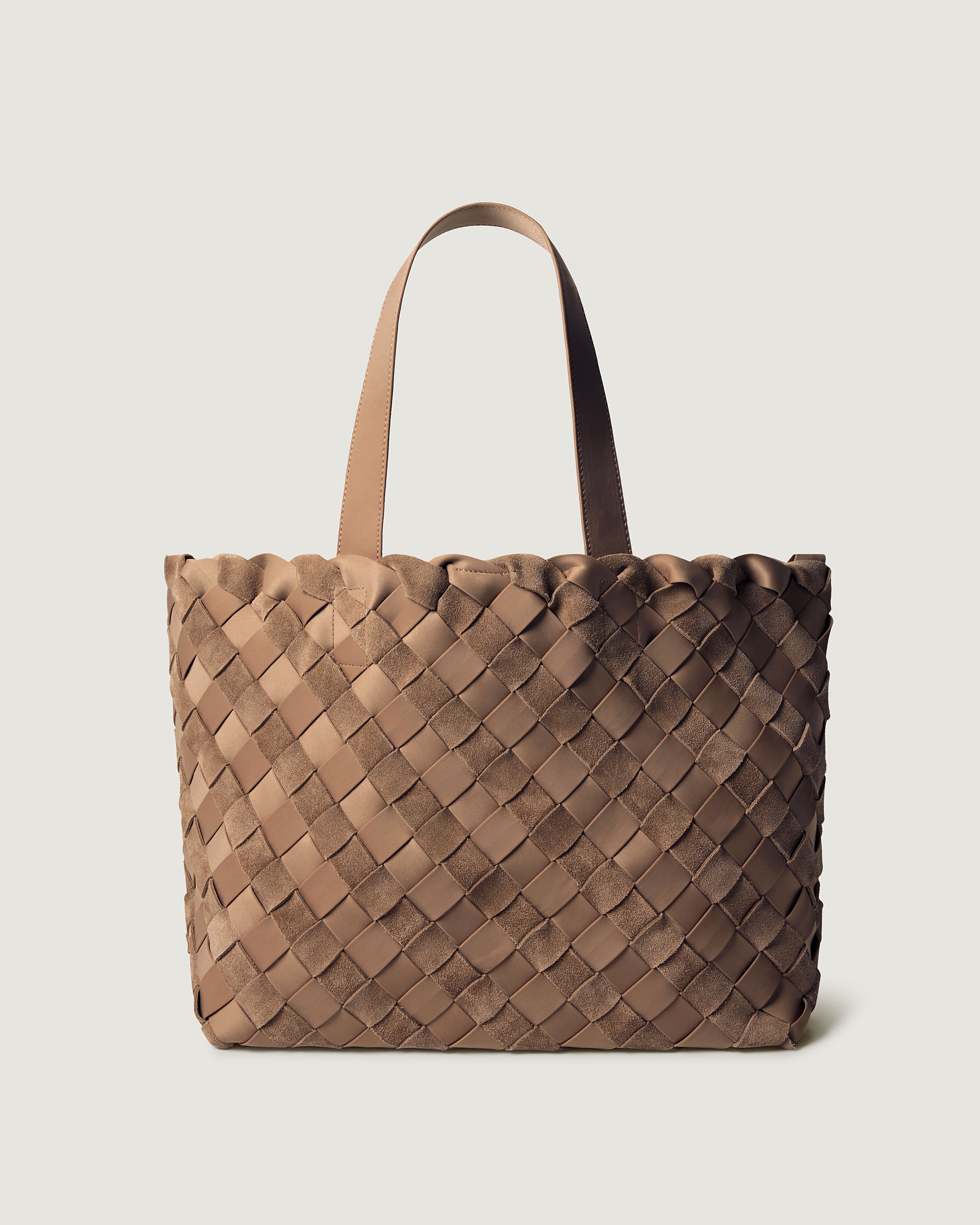 A handwoven suede and neoprene tote bag in a warm taupe-brown color, featuring a diamond-patterned weave and two flat shoulder straps.