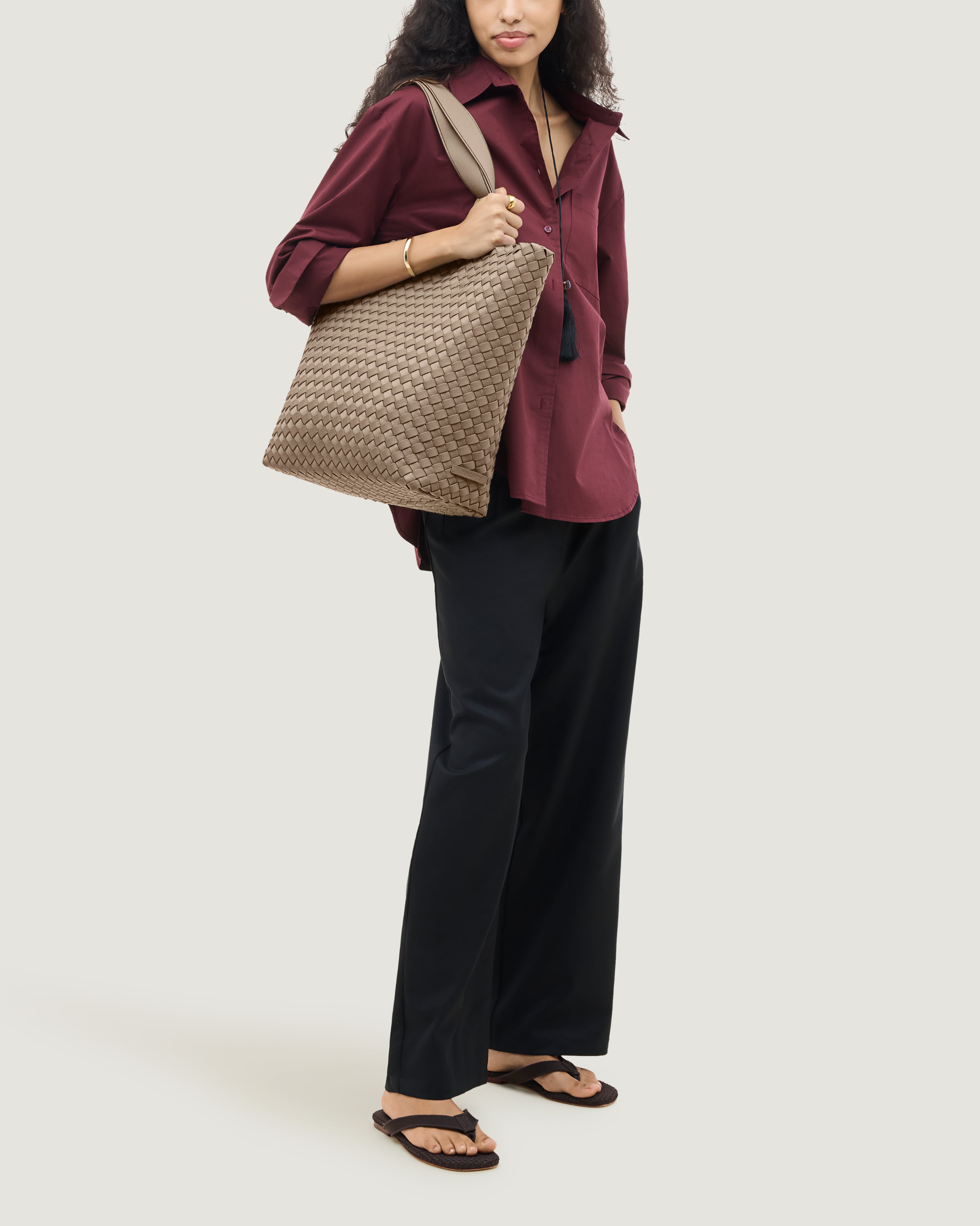 Como Tote in Cashmere shown on model to illustrate scale and soft silhouette.