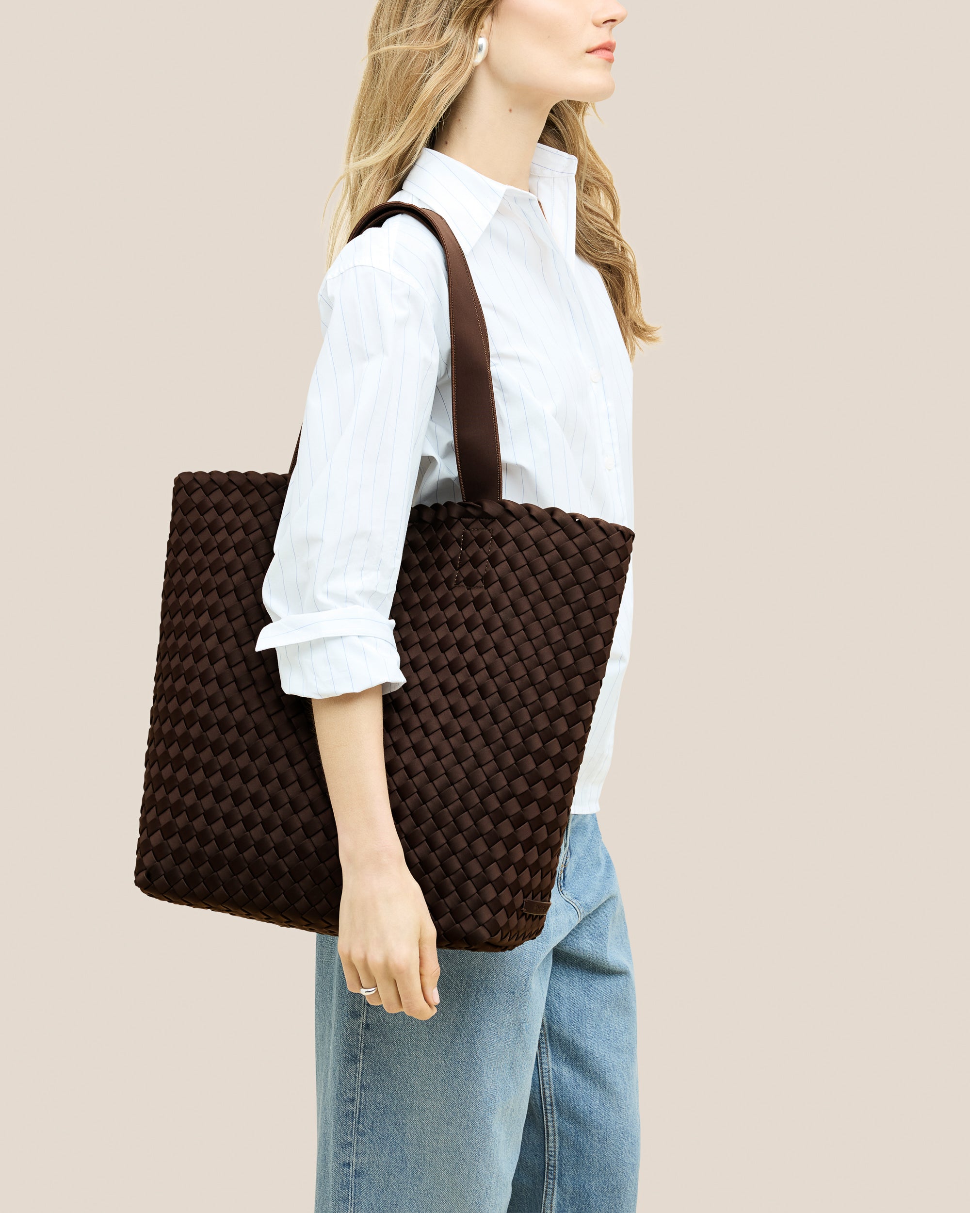 Como Shopper Tote Bag in Chocolate shown on model to illustrate scale and soft silhouette.