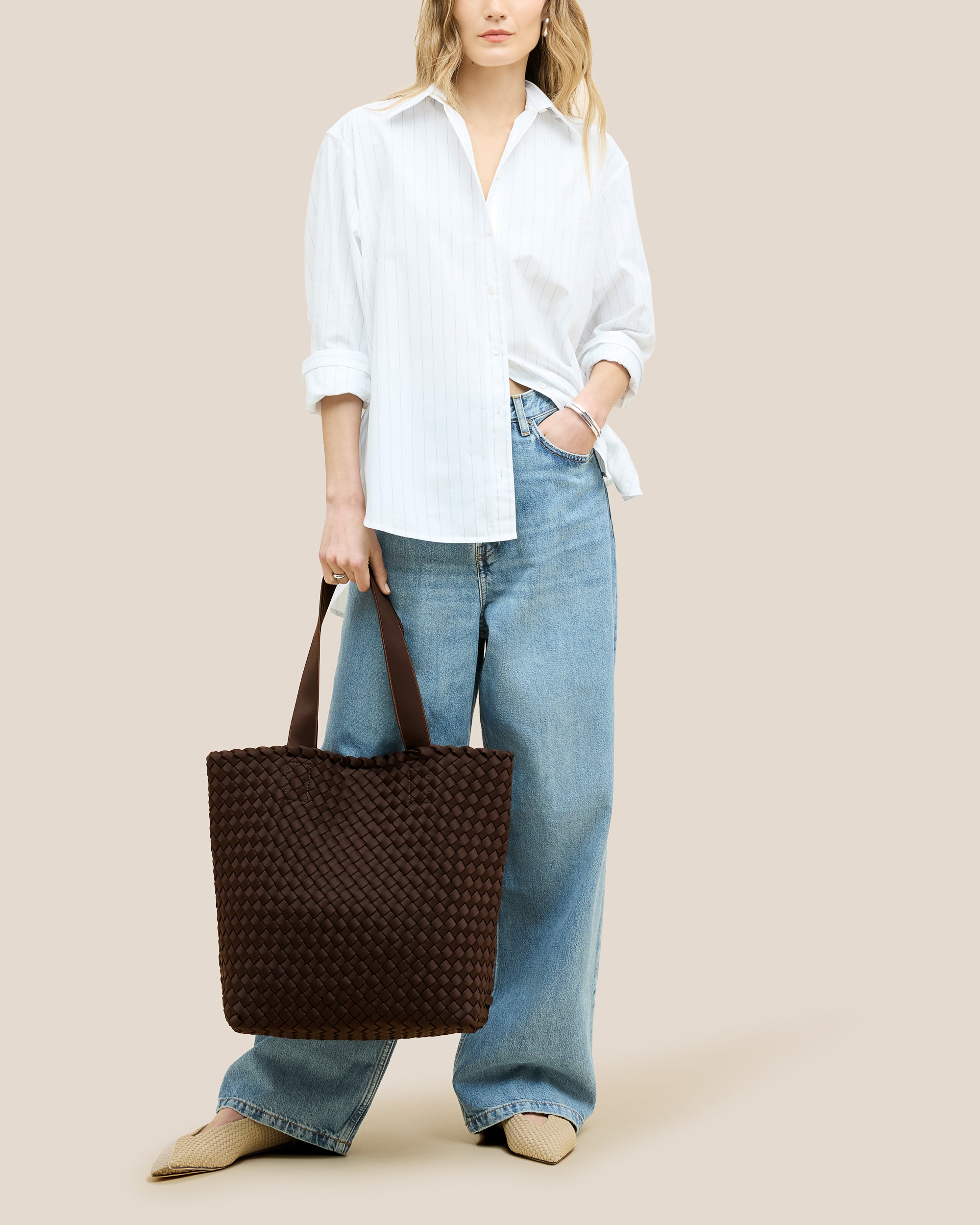 Como Shopper Tote Bag in Chocolate shown on model to illustrate scale and soft silhouette.