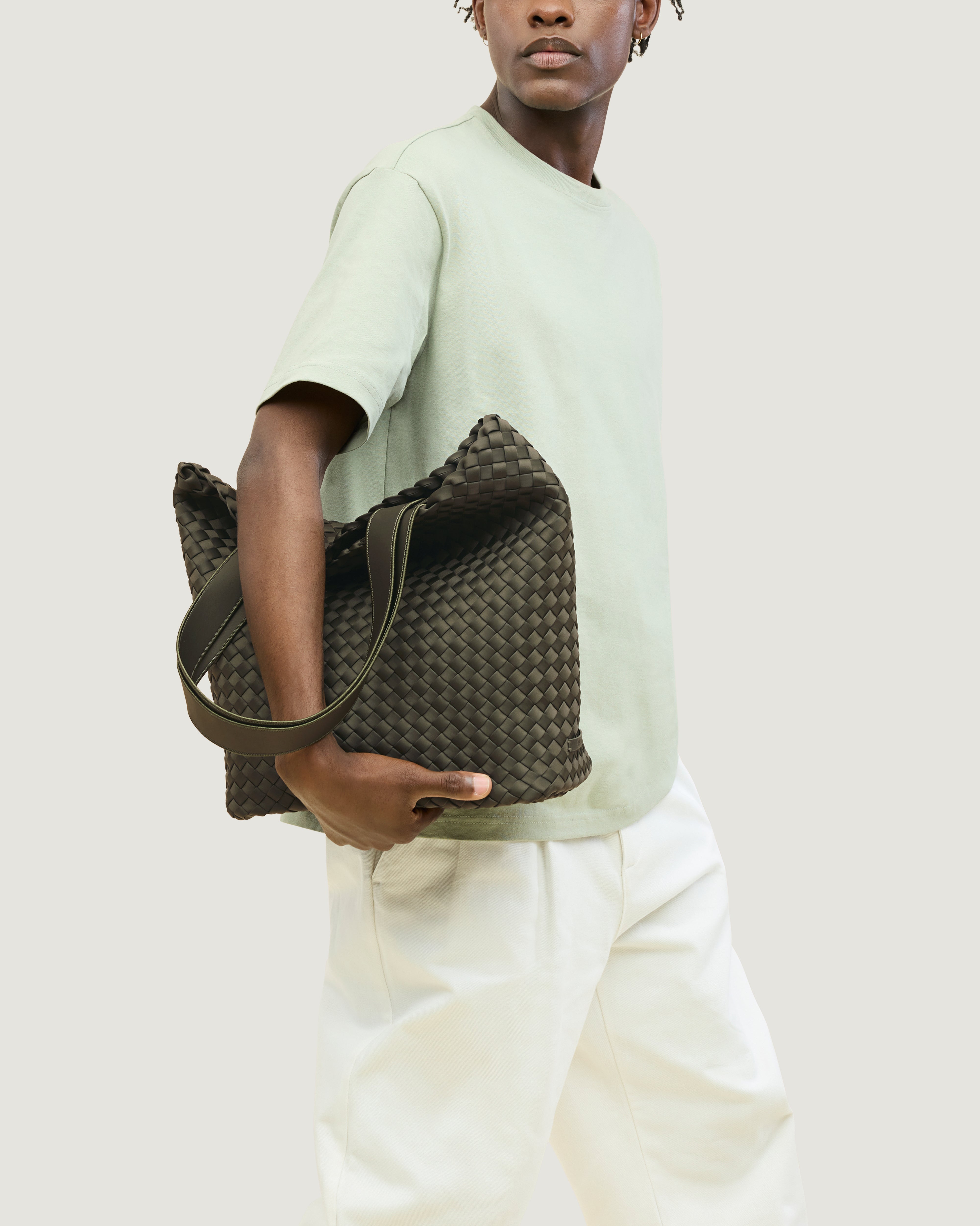 Como Tote in Olive shown on model to illustrate scale and soft silhouette.