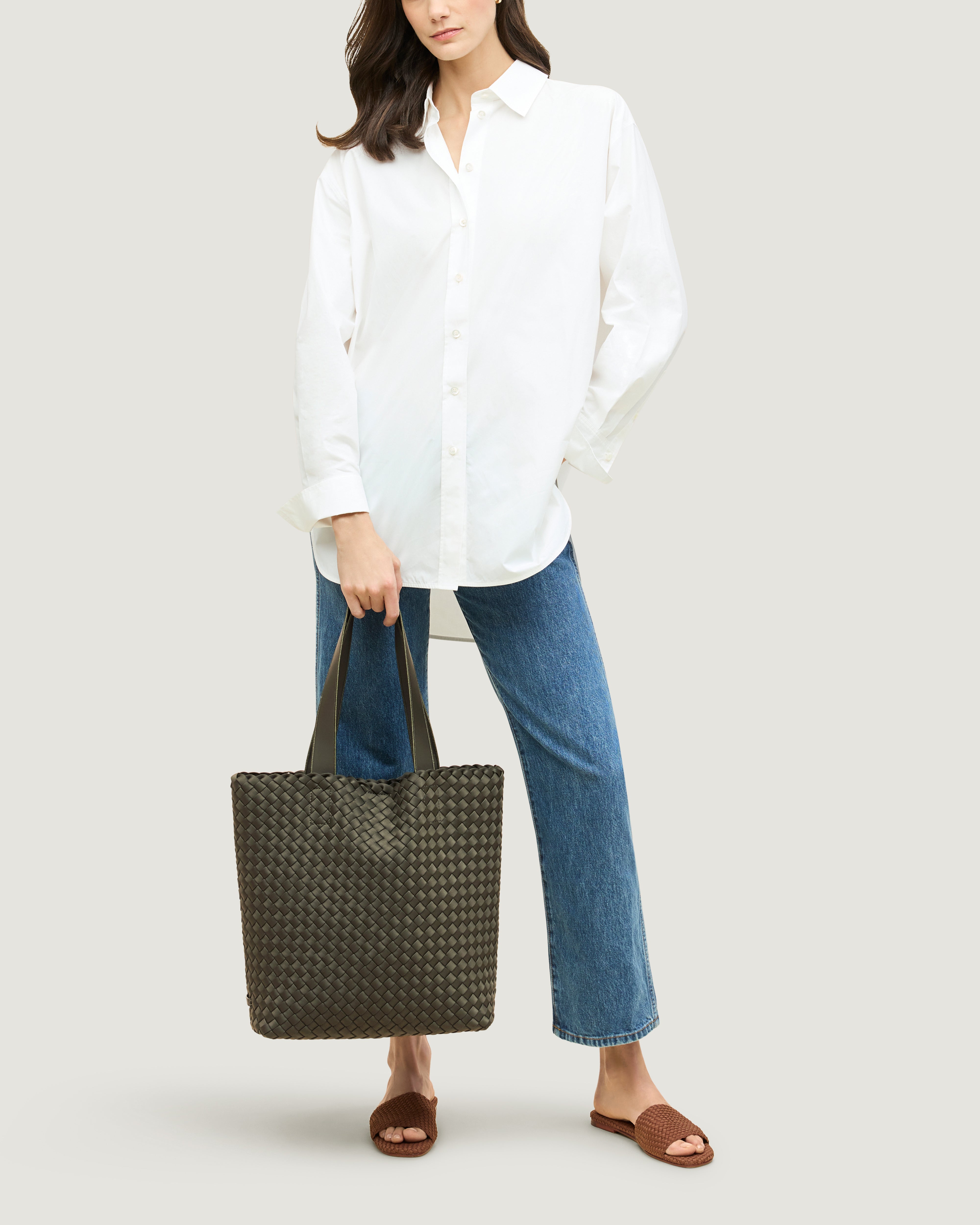 Como Tote in Olive shown on model to illustrate scale and soft silhouette.