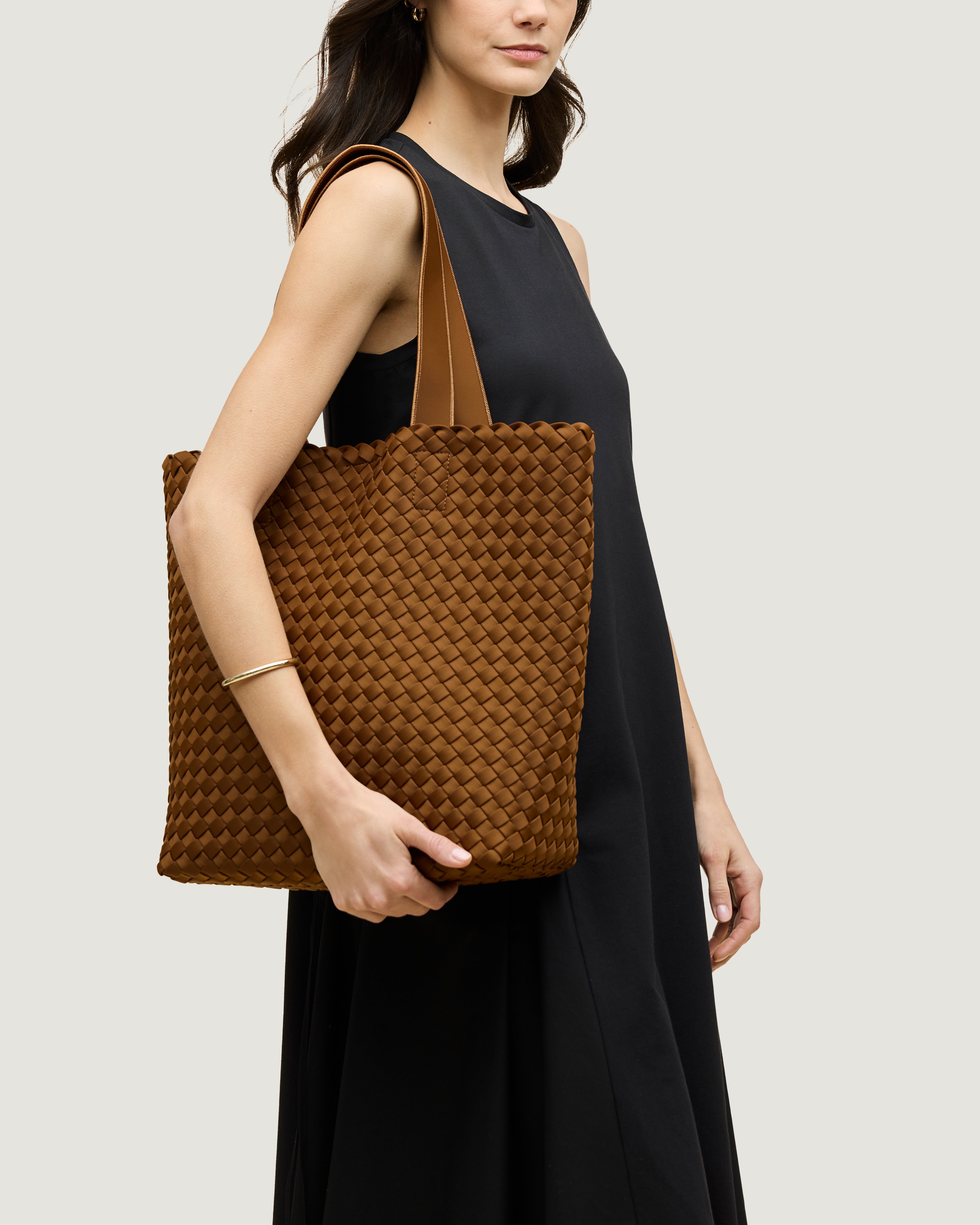 Como Tote in Teak shown on model to illustrate scale and soft silhouette.