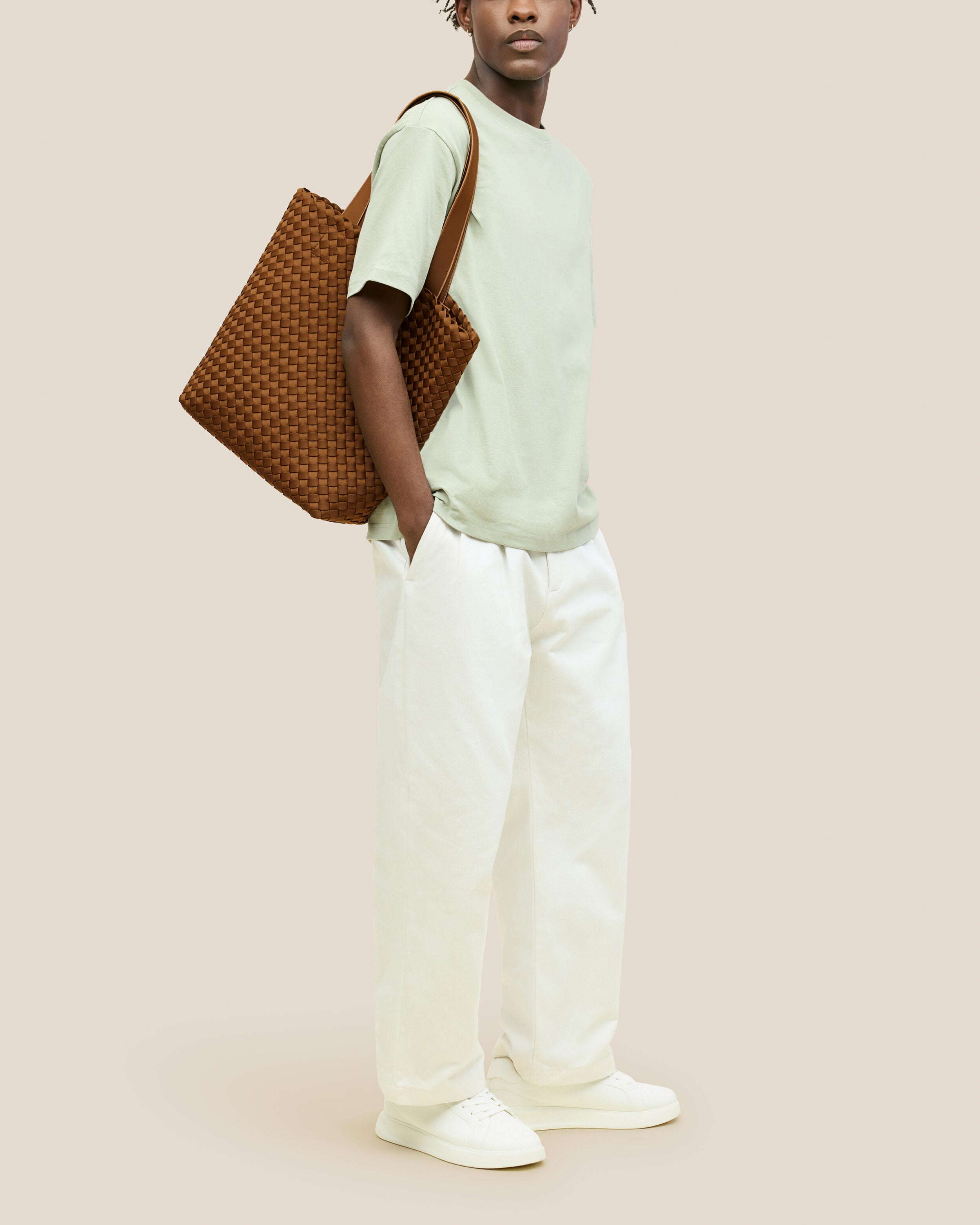Como Tote in Teak shown on model to illustrate scale and soft silhouette.