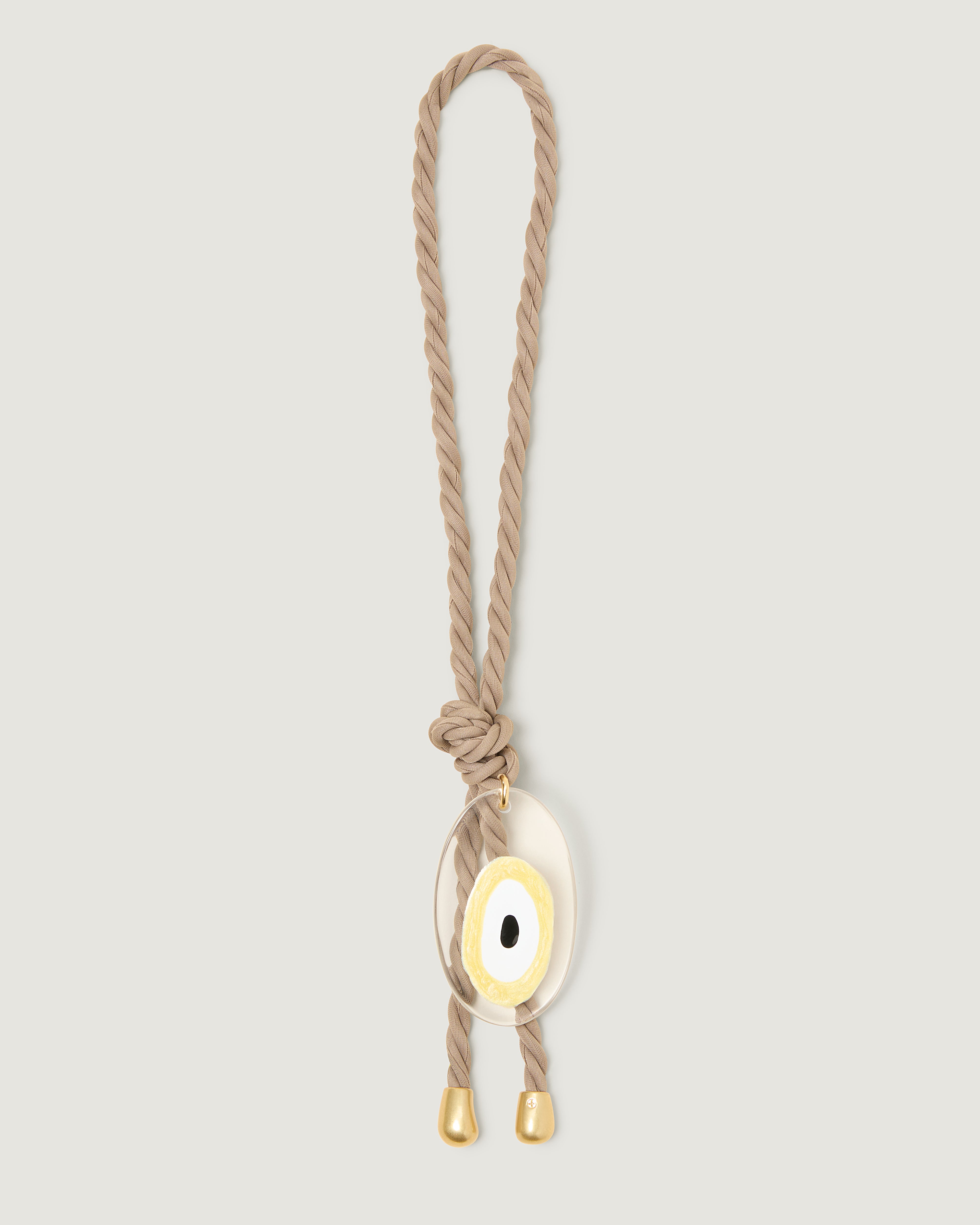 Cashmere neoprene rope bag charm featuring a blue evil eye pendant, finished with gold tips and knotted detail.
