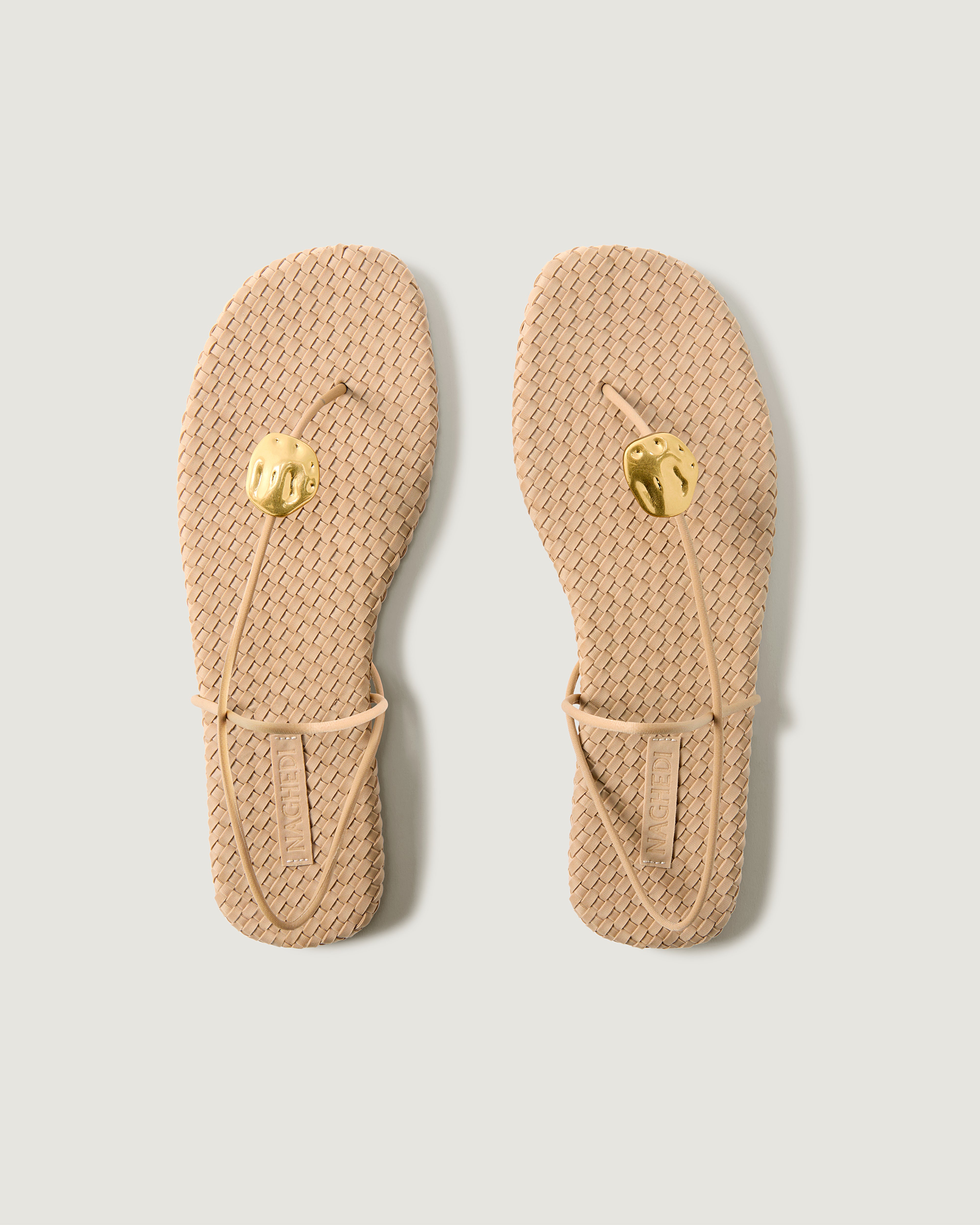 Top view of pair of The Gaia Sandal in Camel showing the handwoven neoprene insole.