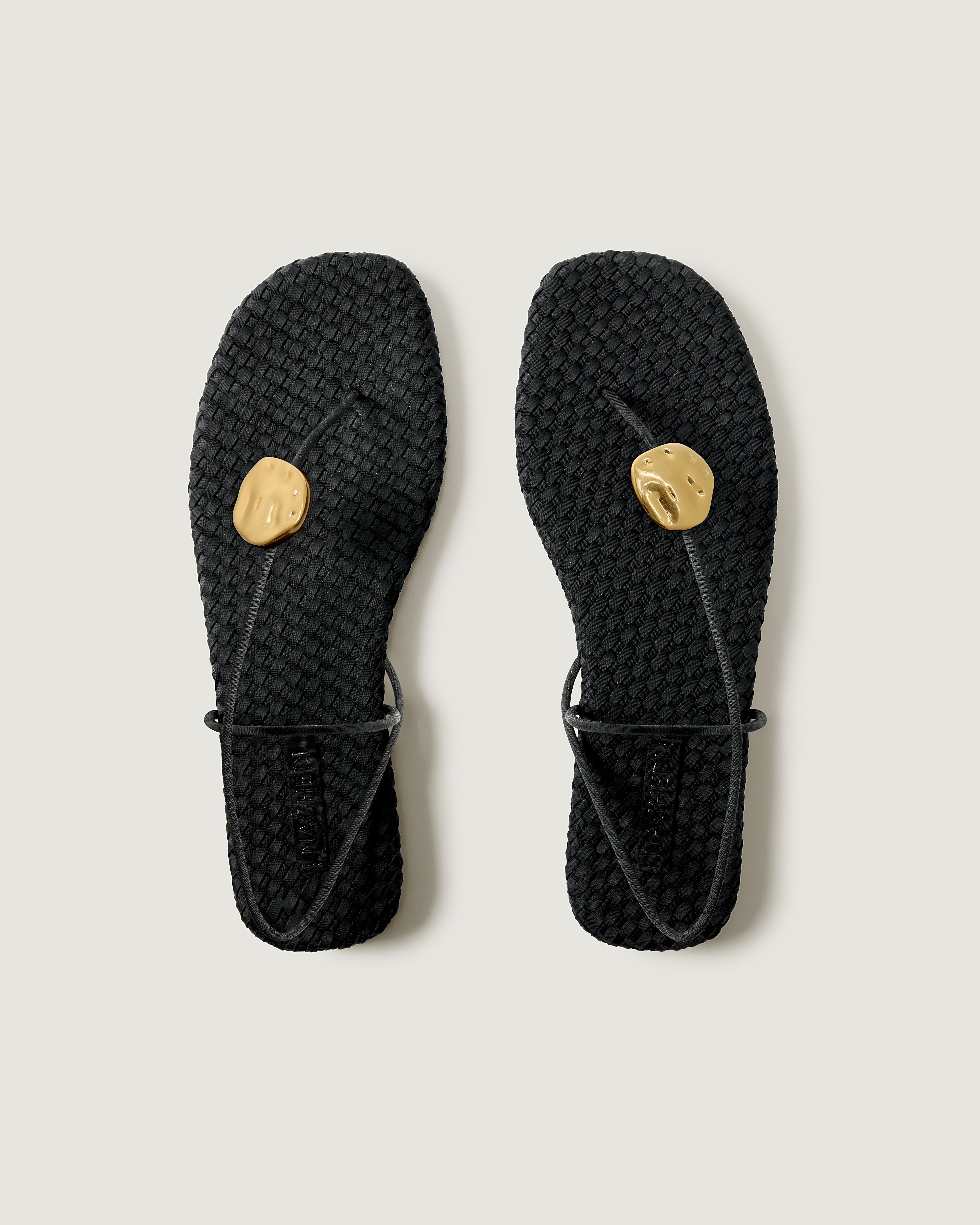 Top view of pair of The Gaia Sandal in Onyx showing the handwoven neoprene insole.