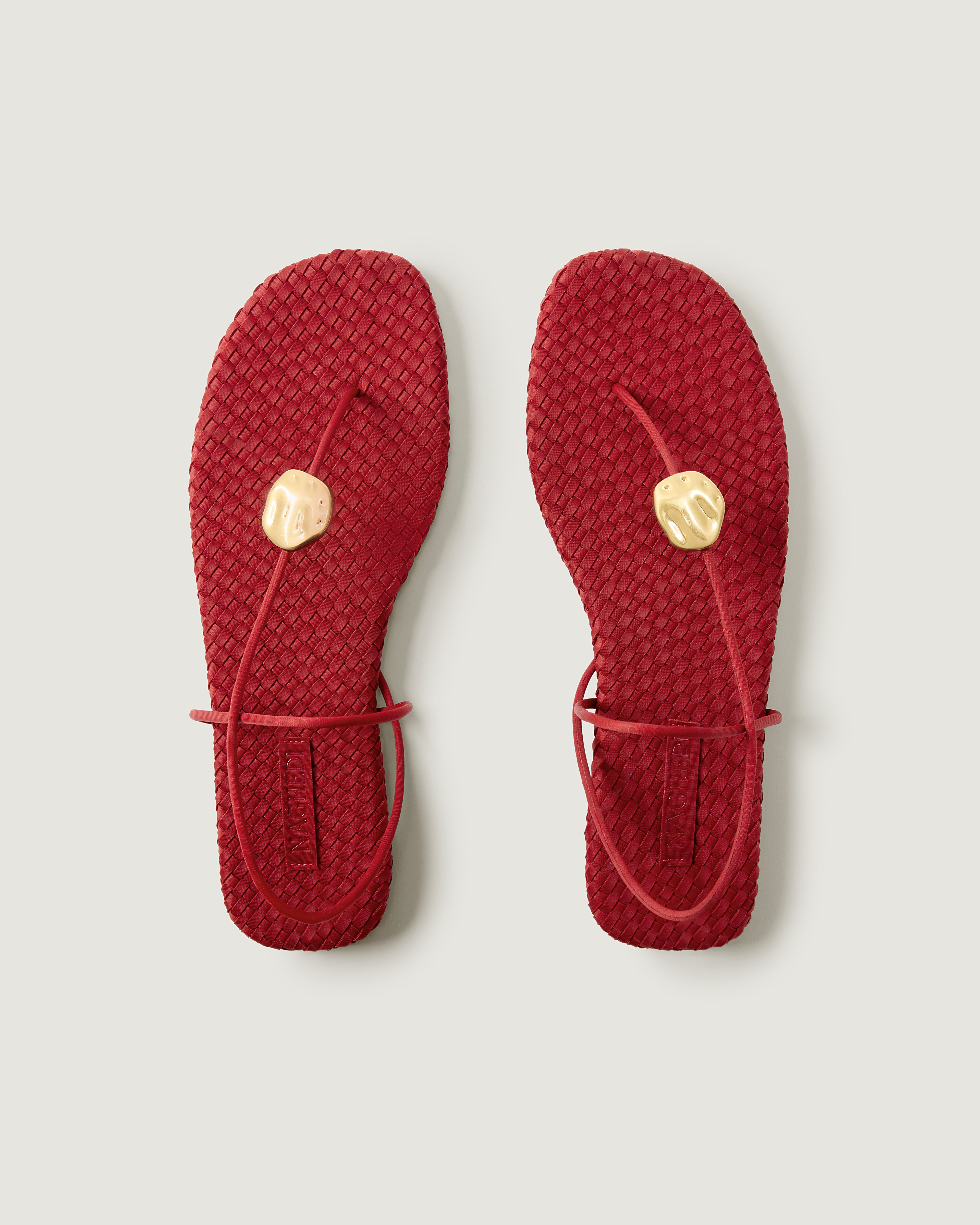 Top view of pair of The Gaia Sandal in Rosso showing the handwoven neoprene insole.