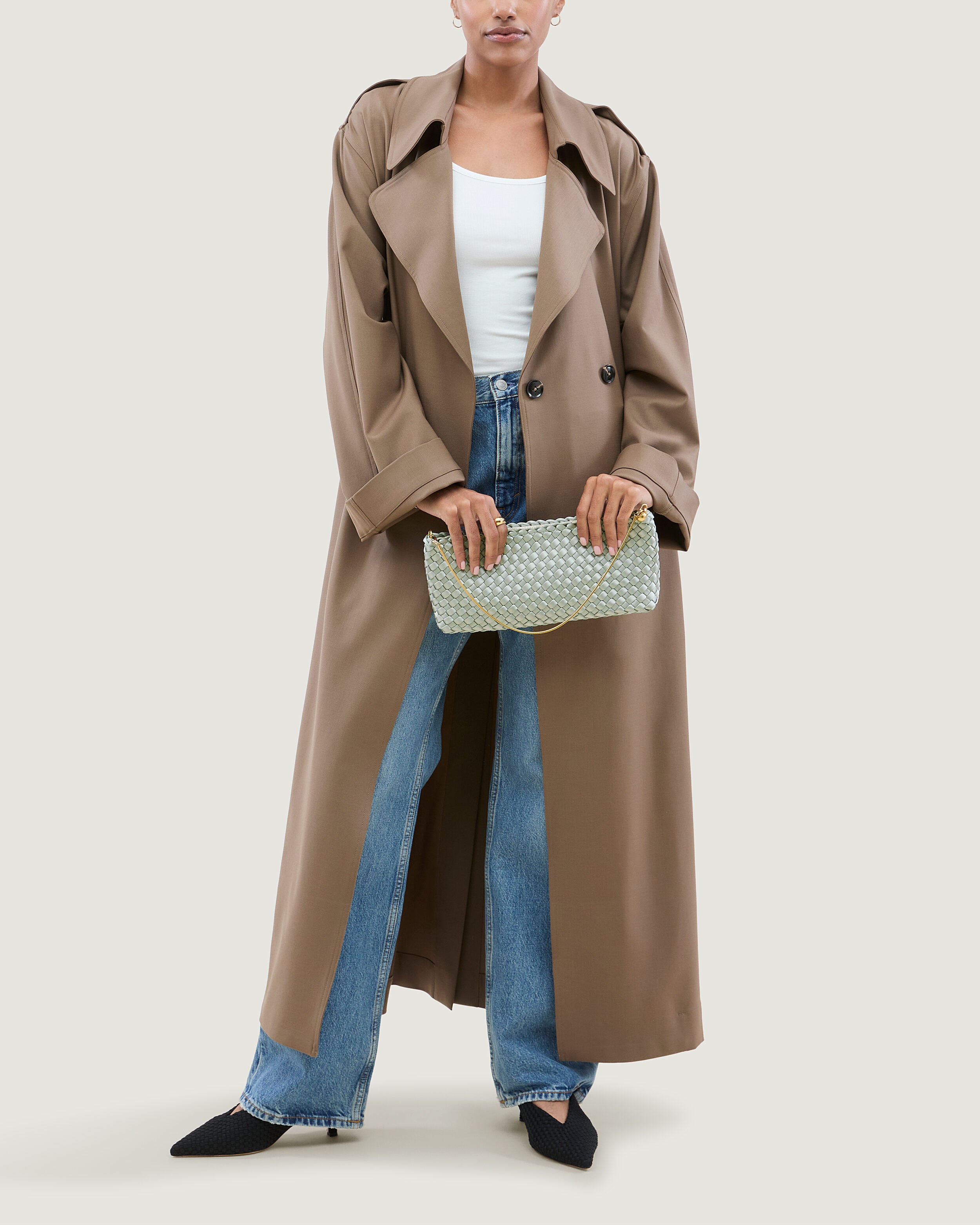 Gala Clutch in Wintergreen shown on model to illustrate scale and soft silhouette.