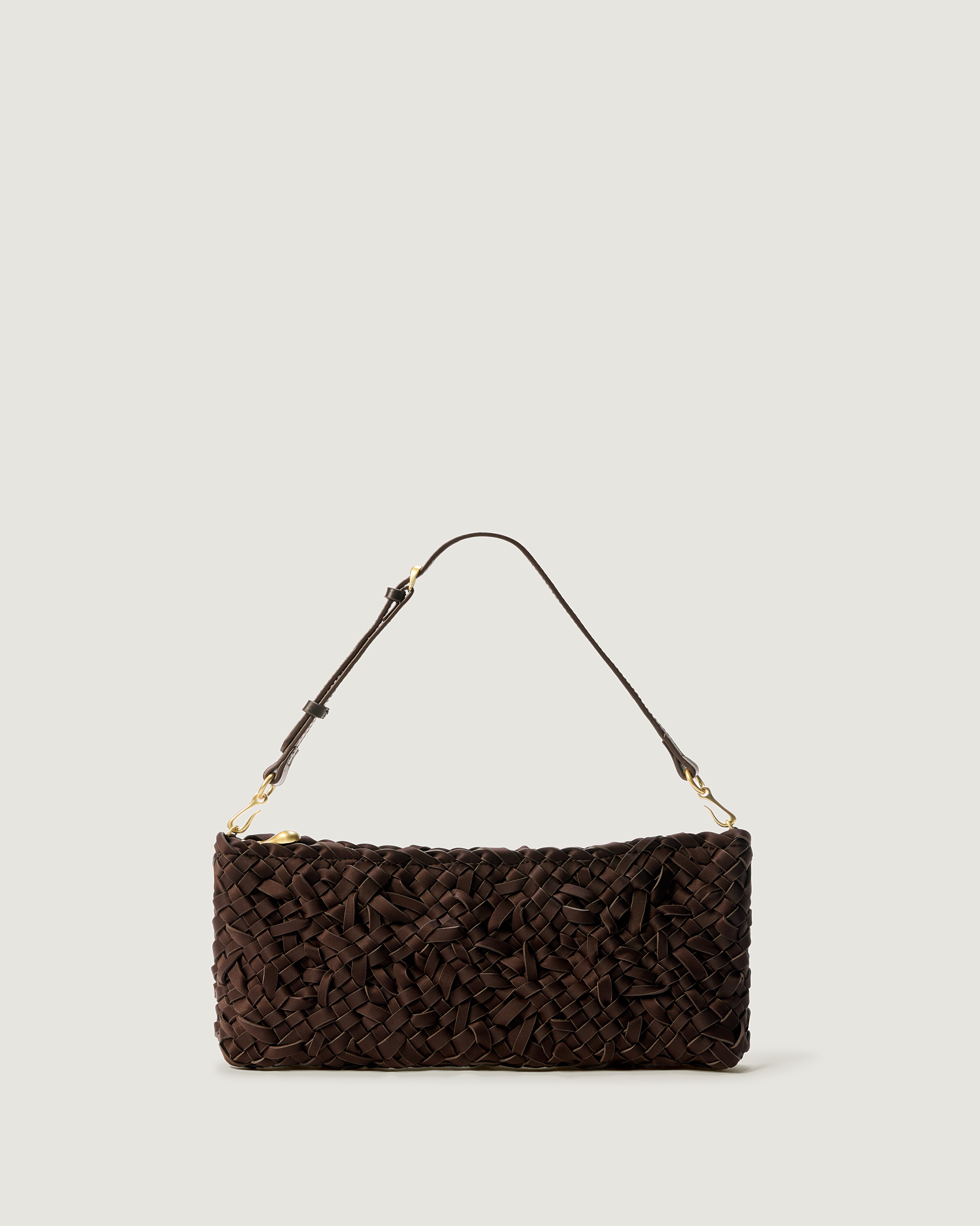 Handwoven neoprene shoulder bag in chocolate brown color with a crosshatch nest weave pattern and gold hardware