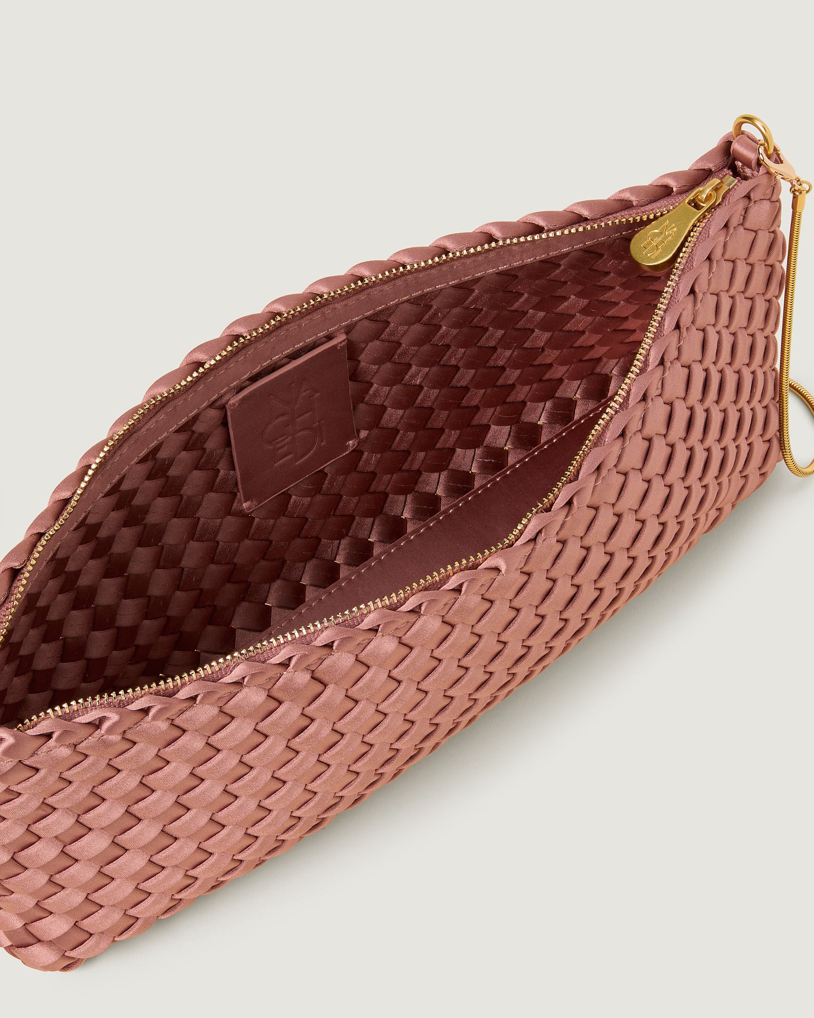 Interior close-up of Gala Medium Satin Clutch Bag in Daphne showing its top zip closure.