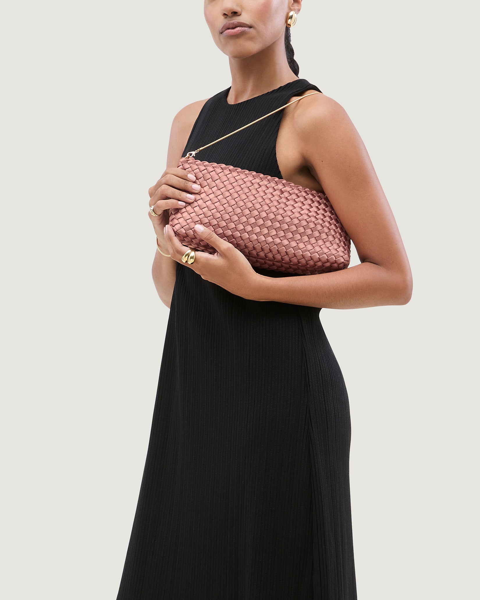 Gala Medium Satin Clutch Bag in Daphne shown on model to illustrate scale and soft silhouette.