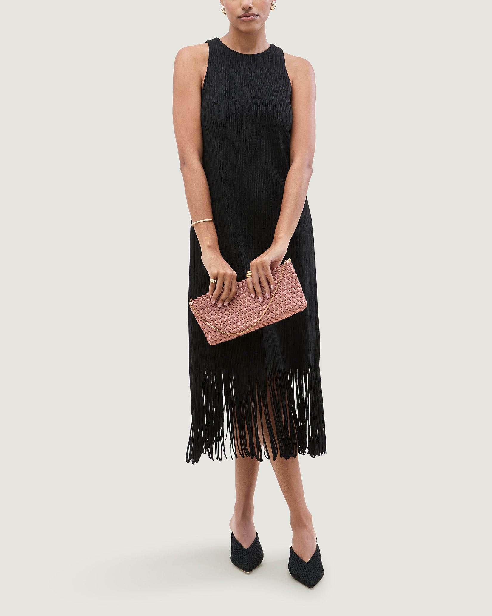 Gala Medium Satin Clutch Bag in Daphne shown on model to illustrate scale and soft silhouette.