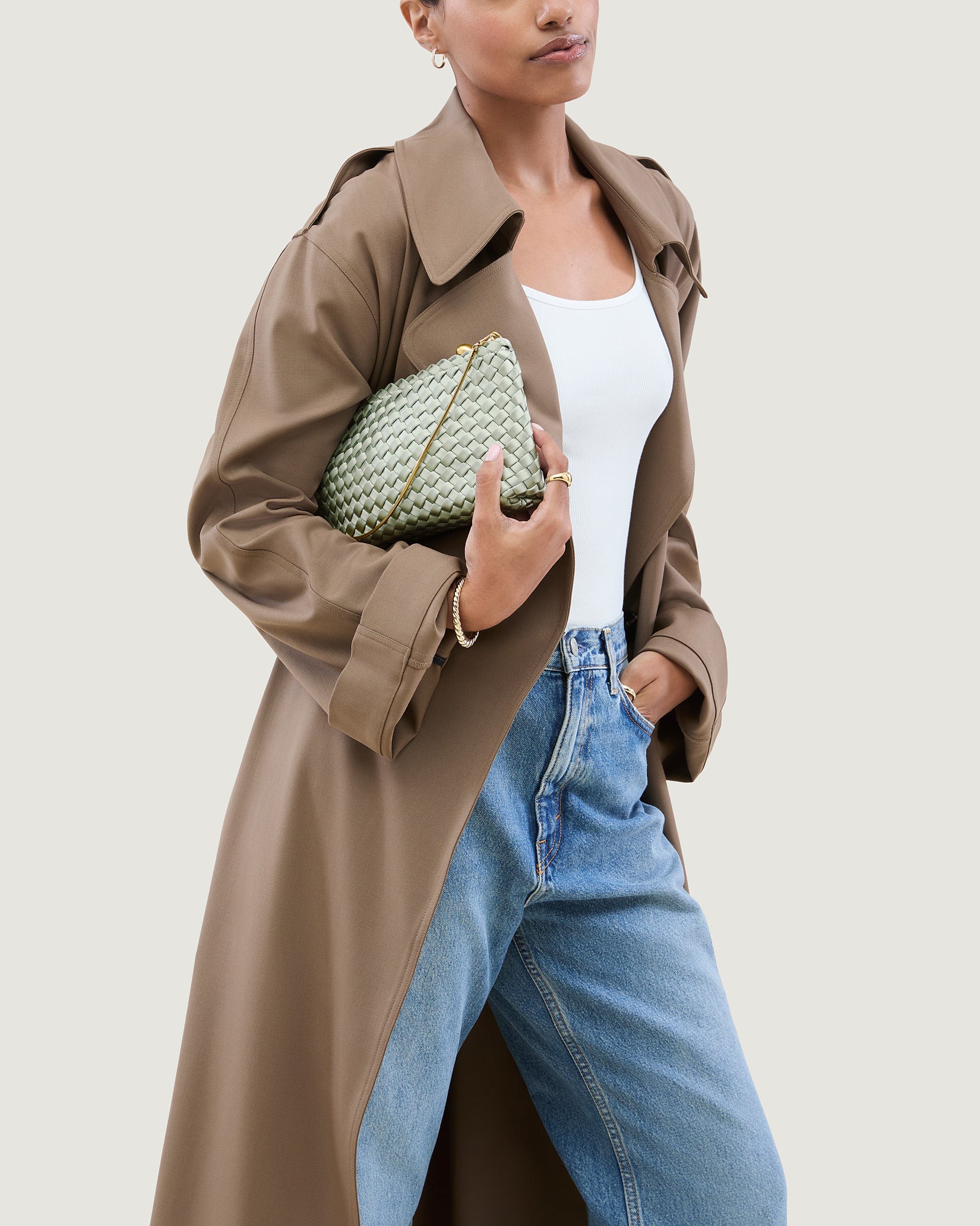 Gala Medium Satin Clutch Bag in Wintergreen shown on model to illustrate scale and soft silhouette.