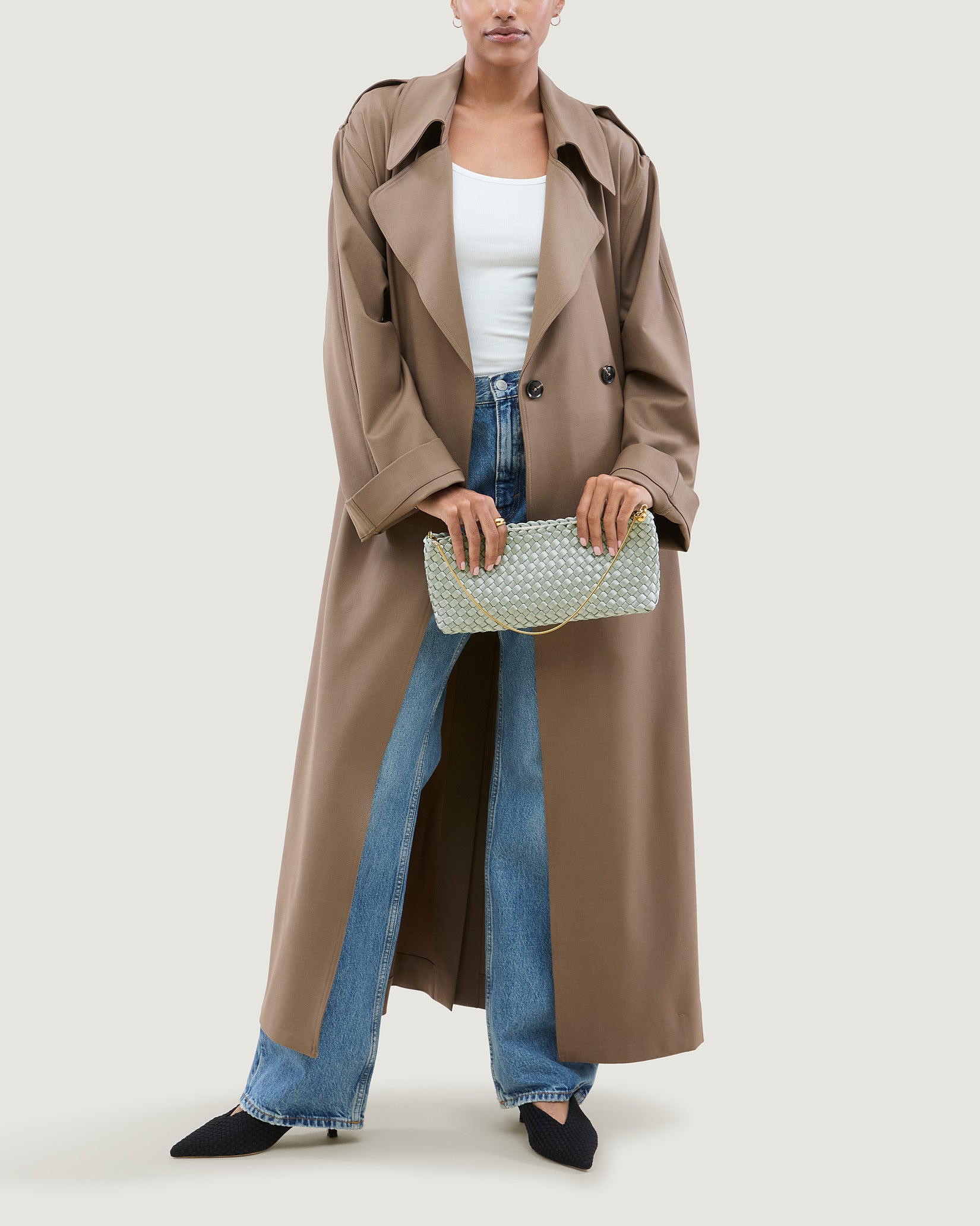 Gala Medium Satin Clutch Bag in Wintergreen shown on model to illustrate scale and soft silhouette.