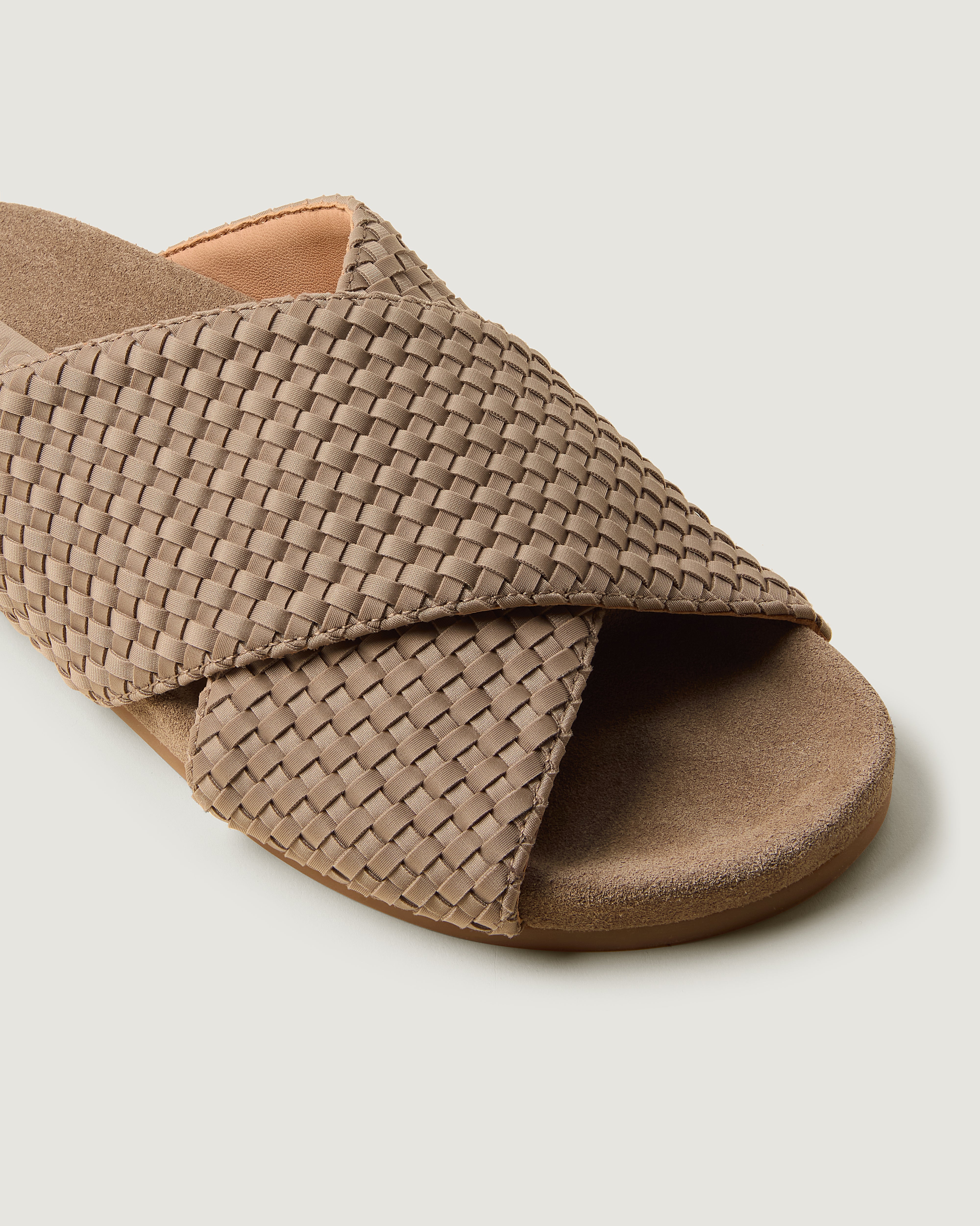 Close-up of The Geneva Slide in Cashmere showing its open toe and round silhouette.
