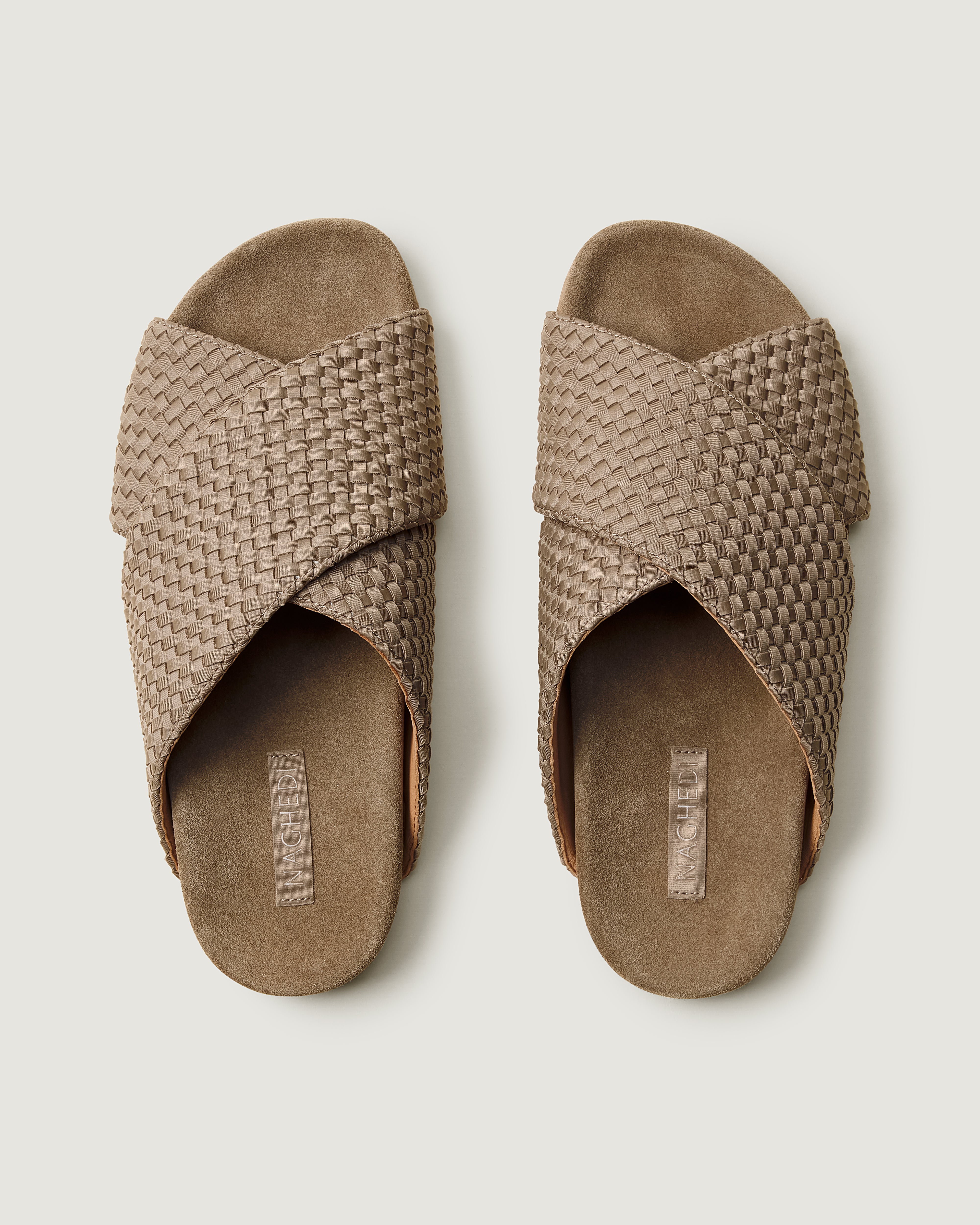 Top view of pair of The Geneva Slide in Cashmere showing the padded, molded suede footbed.