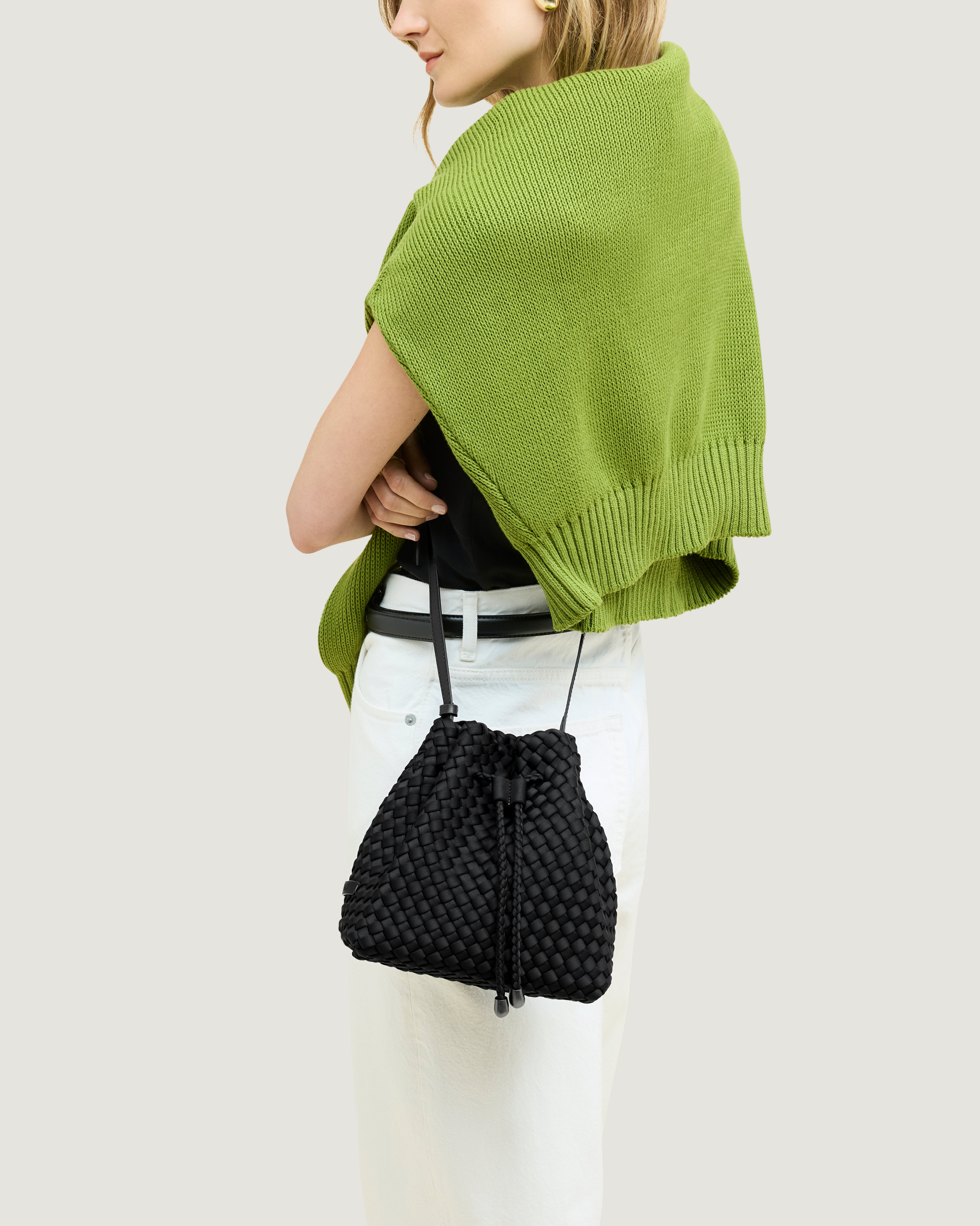 Gramercy Bucket in Onyx shown on model to illustrate scale and soft silhouette.